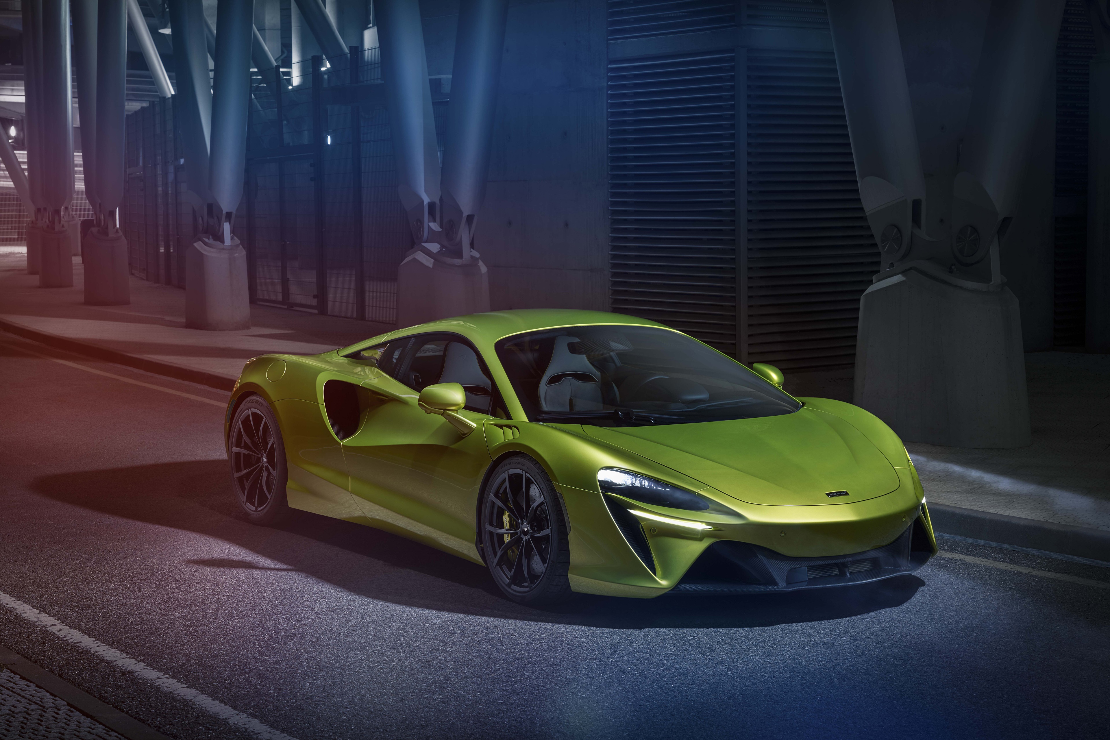 Yellow green McLaren sports car on a street HD Wallpaper