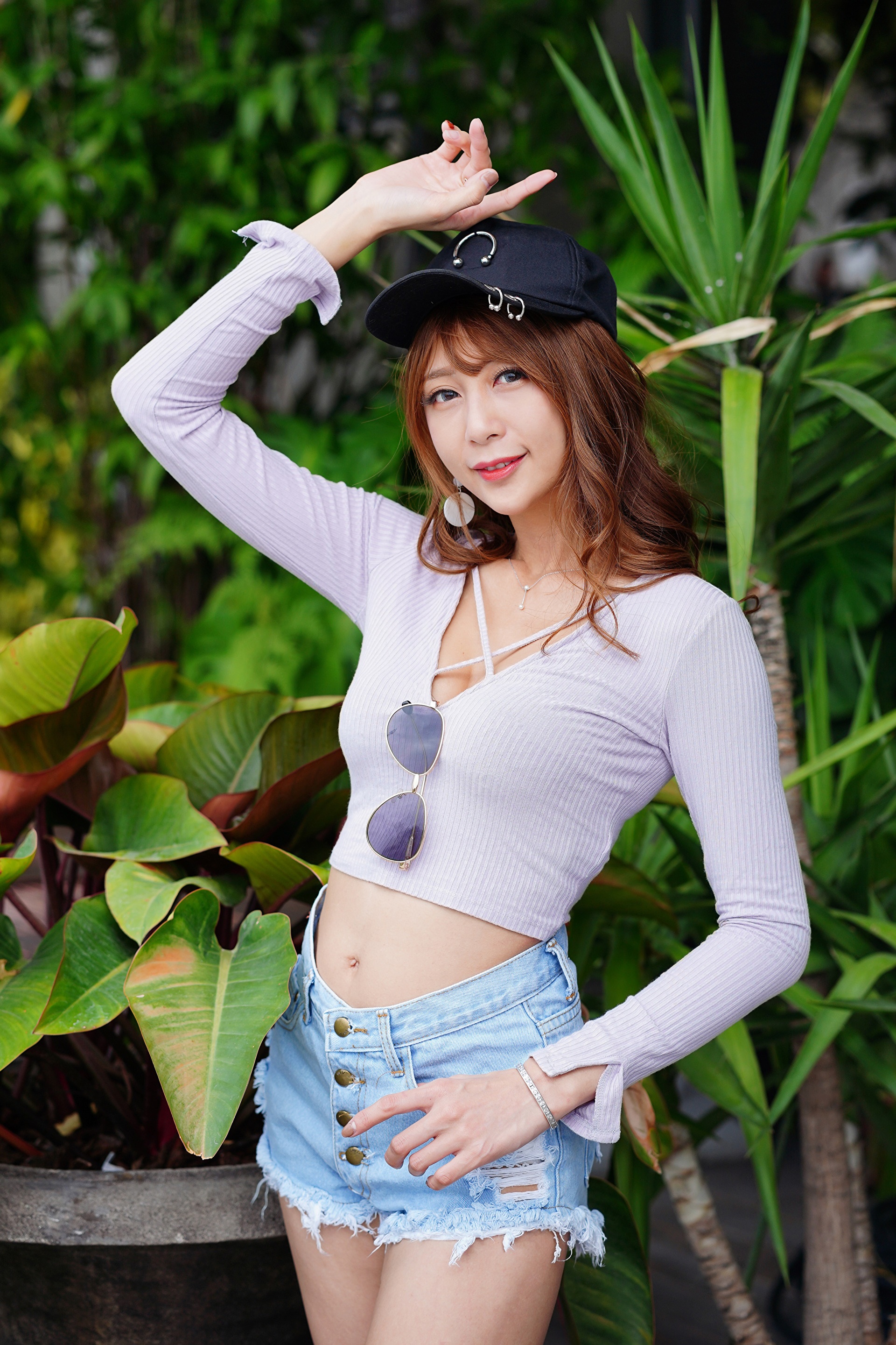 Asian woman in shorts and blouse wearing a baseball cap HD Phone Wallpaper