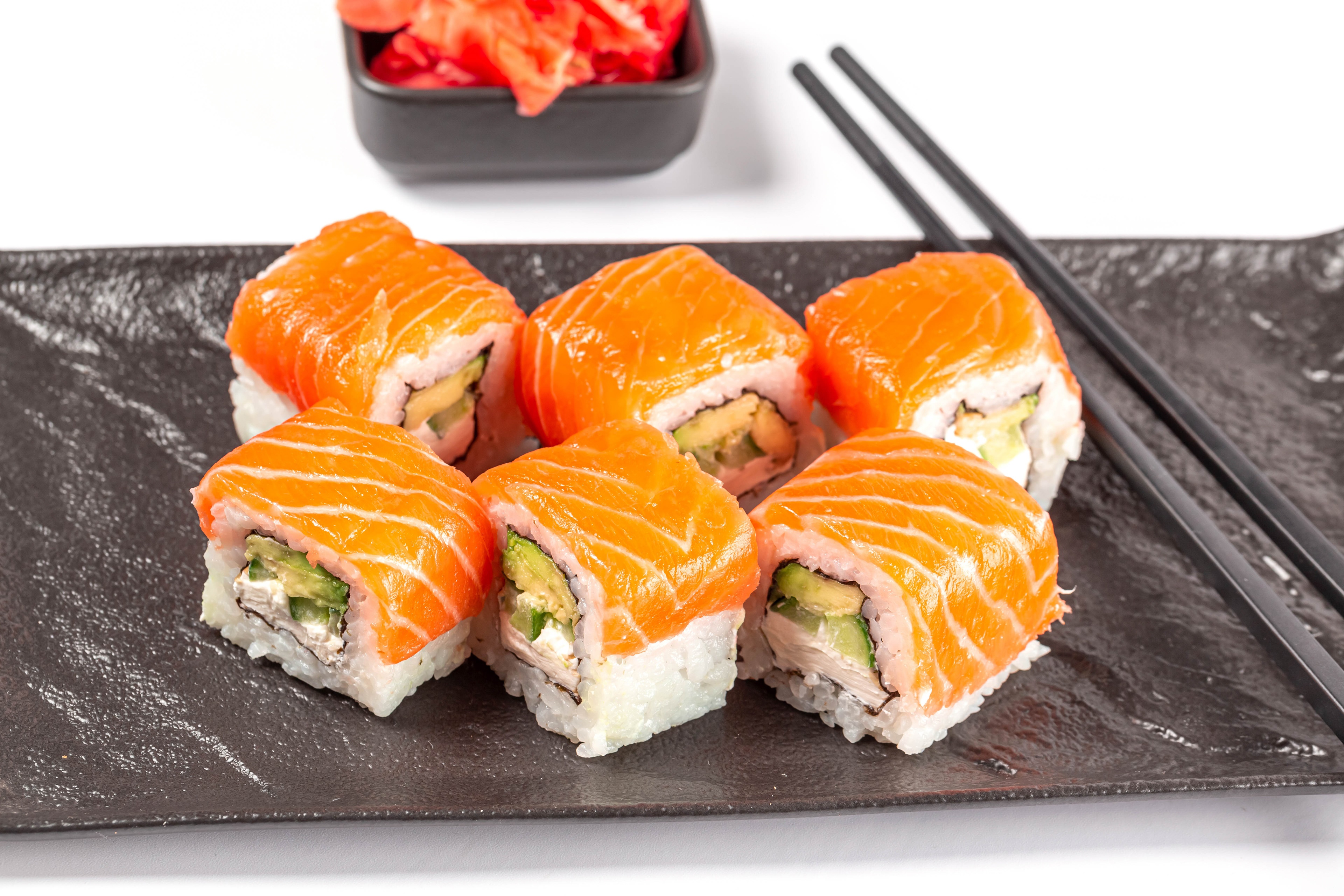 Sushi with salmon and avocado on a plate HD Wallpaper