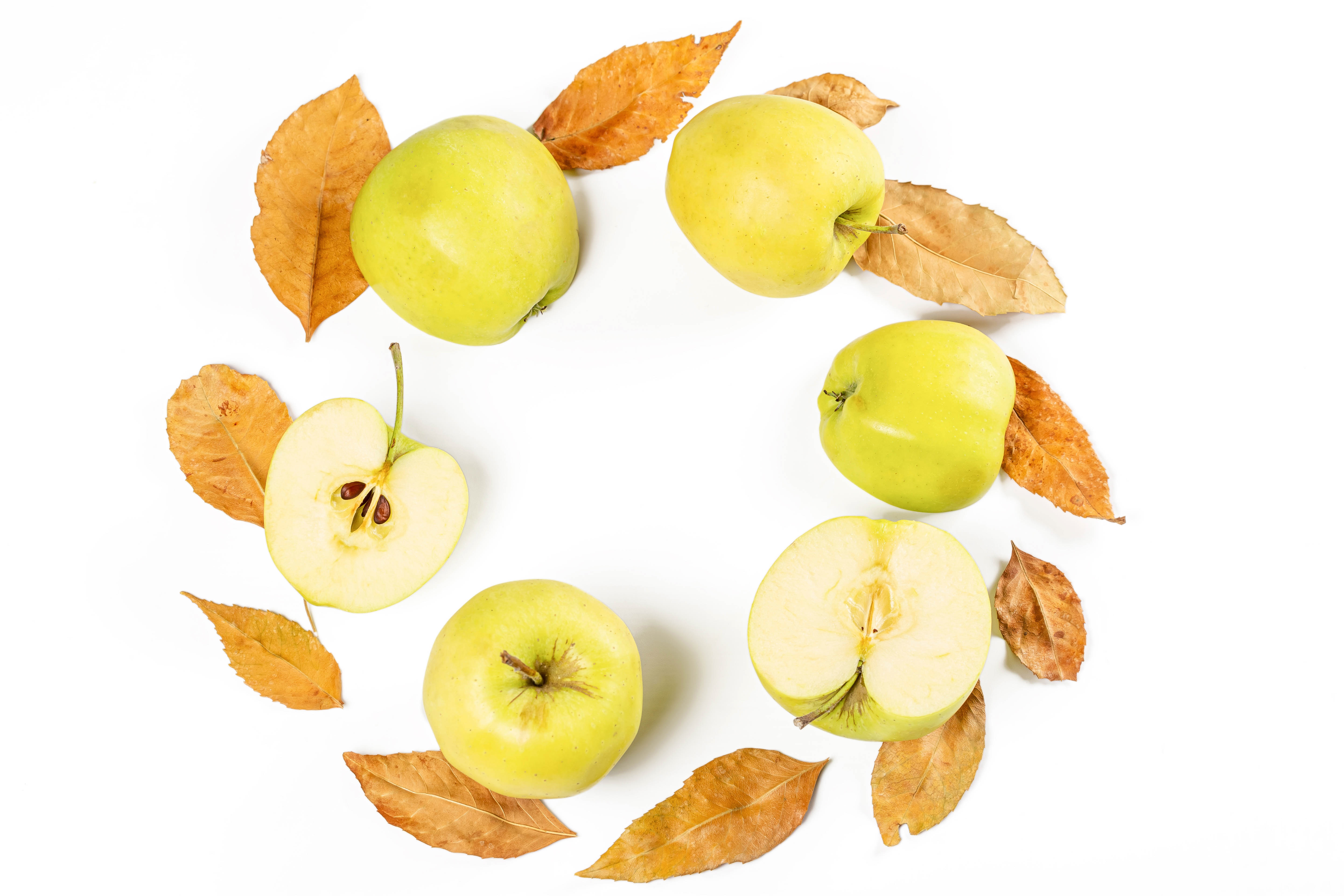 Apples and autumn leaves on white background HD Wallpaper