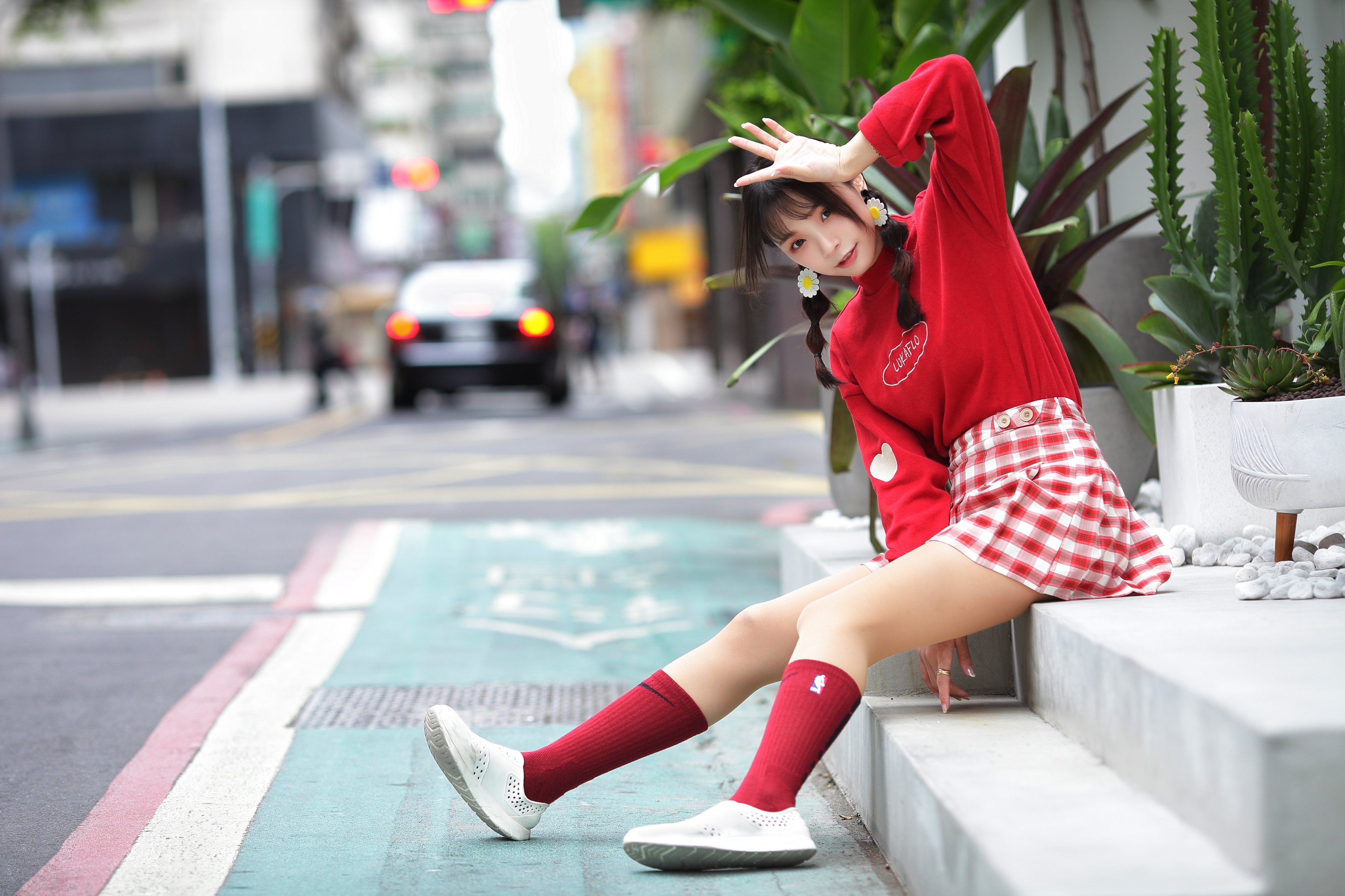 Asian girl in red outfit sitting on steps HD Wallpaper