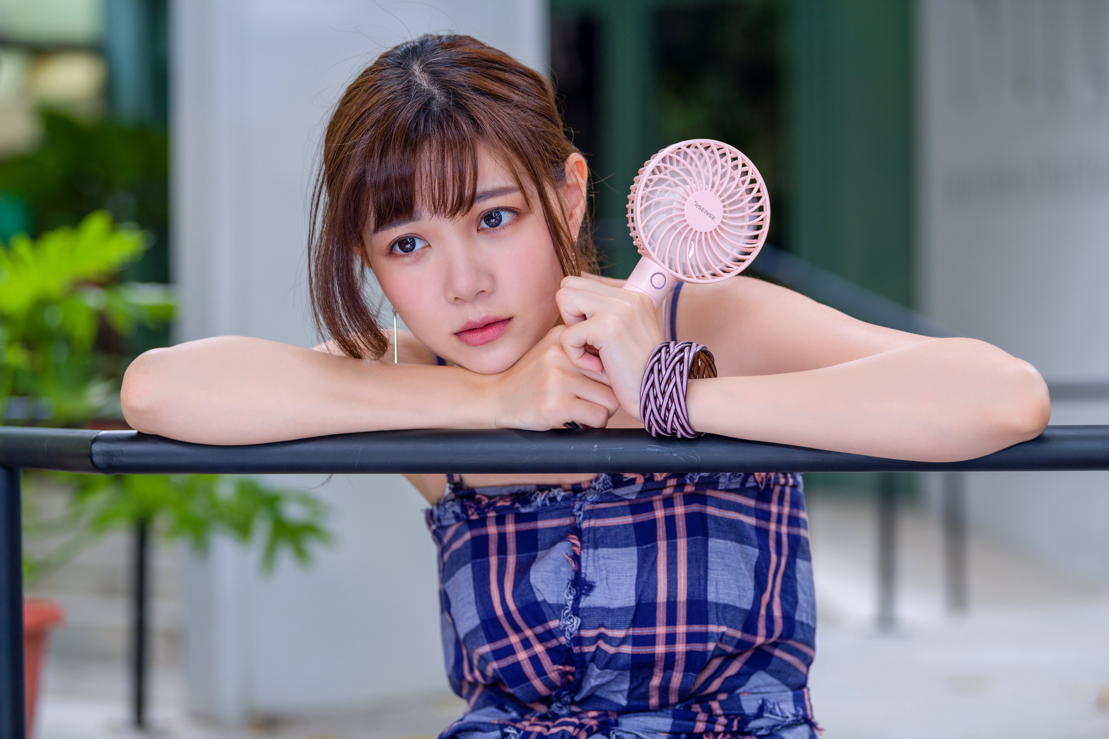 Asian girl with brown hair holding a pink fan HD Wallpaper