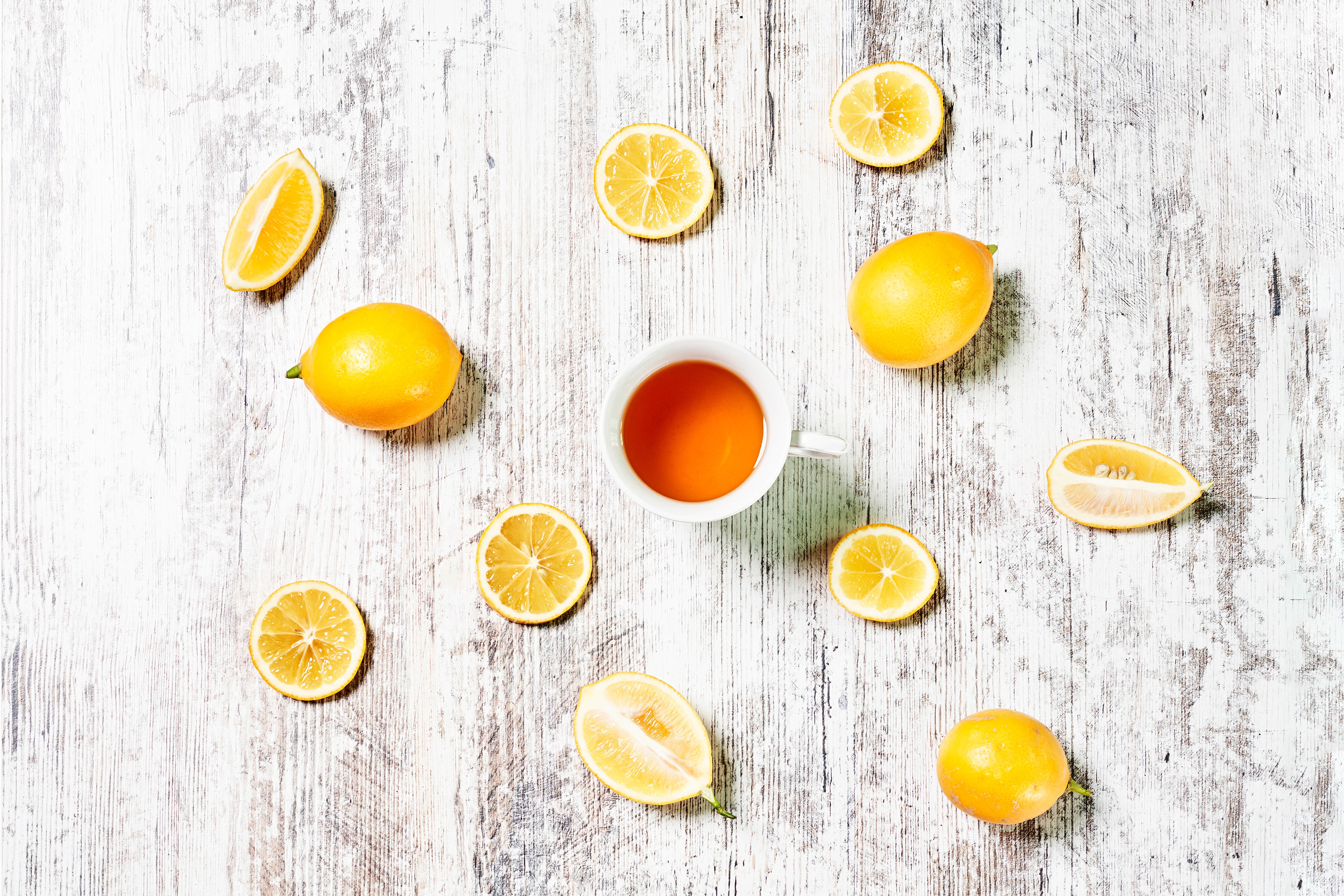 Tea and Lemons on a Wooden Table HD Wallpaper