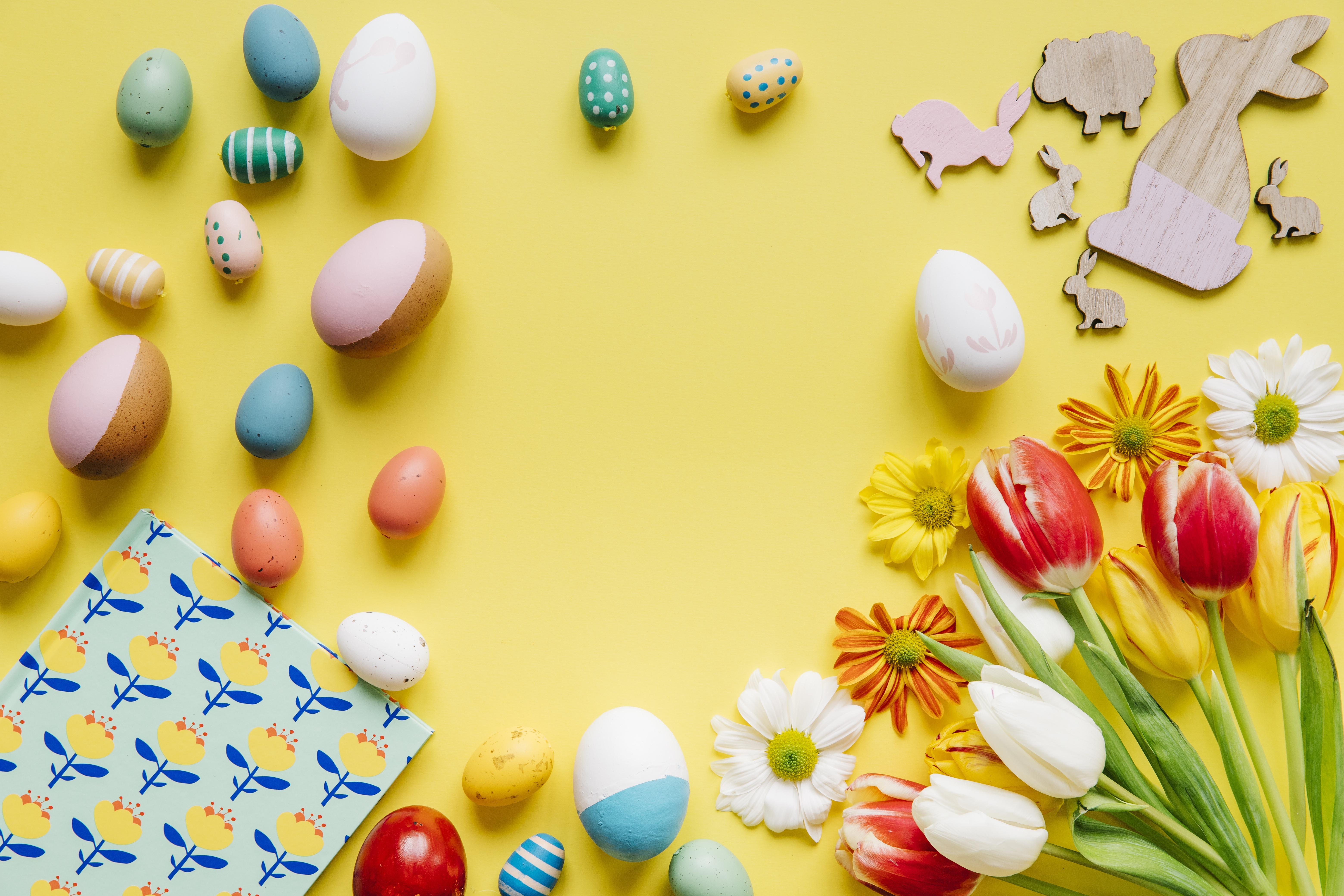 Easter eggs and tulips on yellow background HD Wallpaper