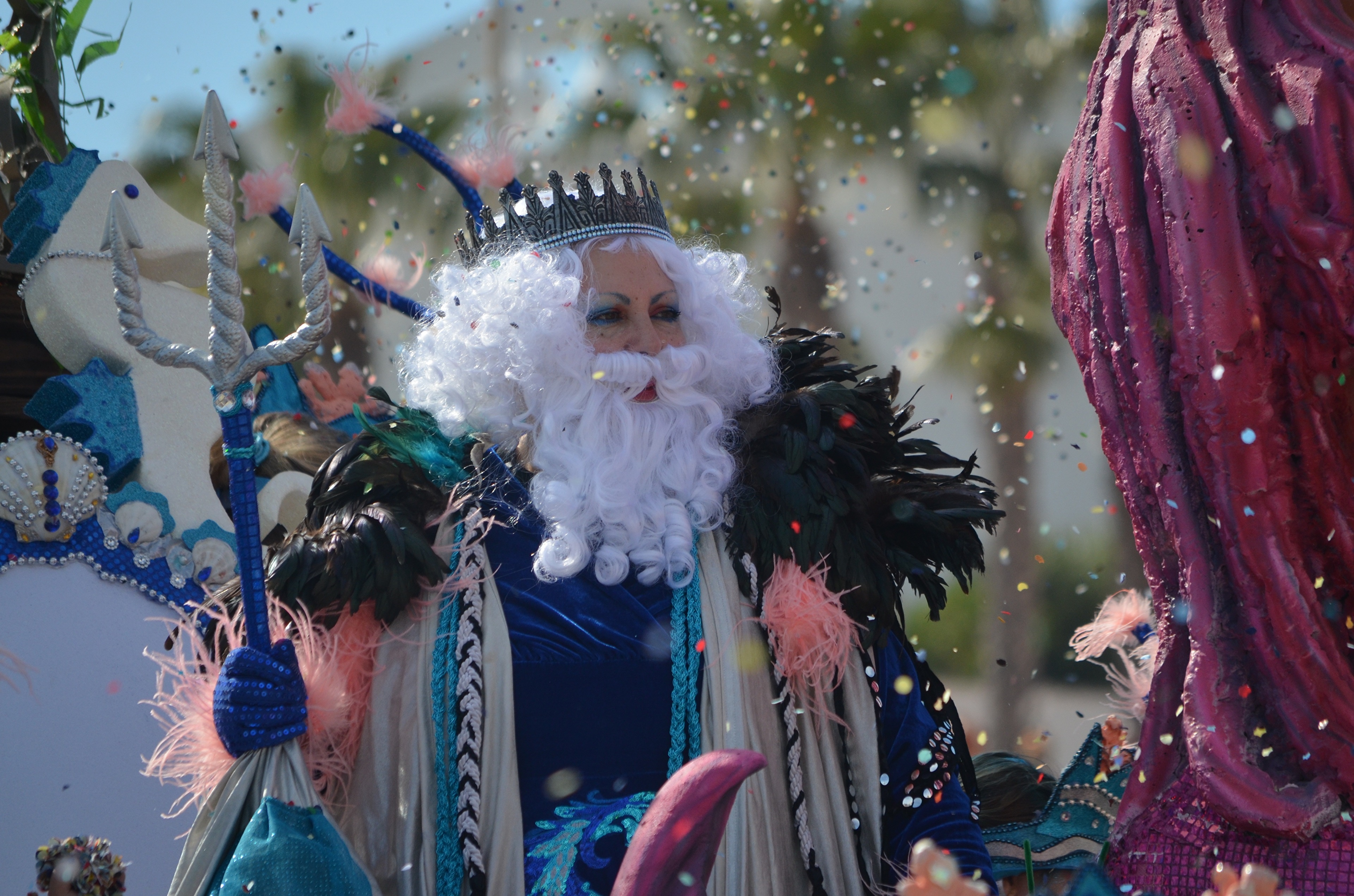 Man dressed as Neptune with a trident and crown HD Wallpaper