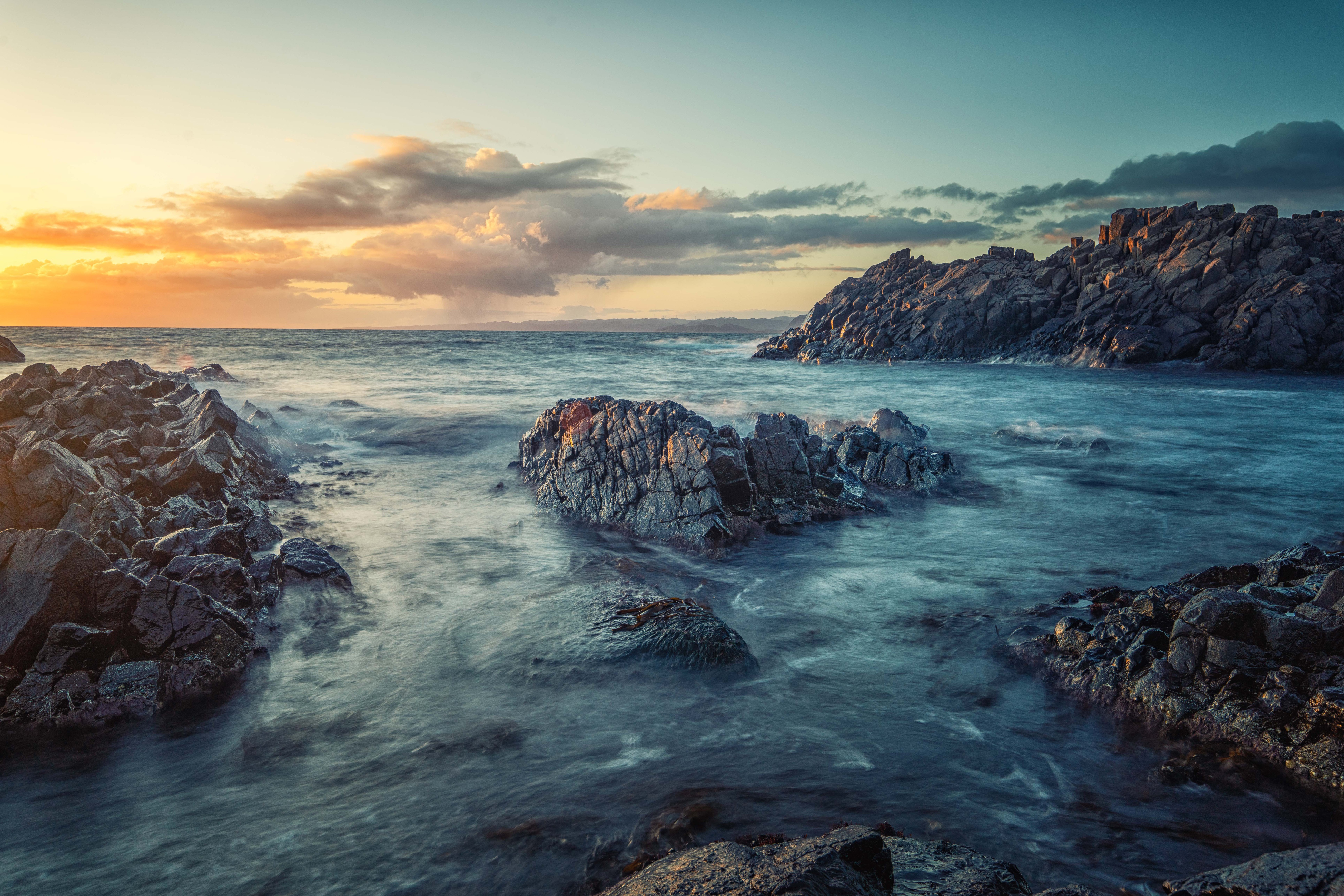 Sea coast with rocks at sunset HD Wallpaper
