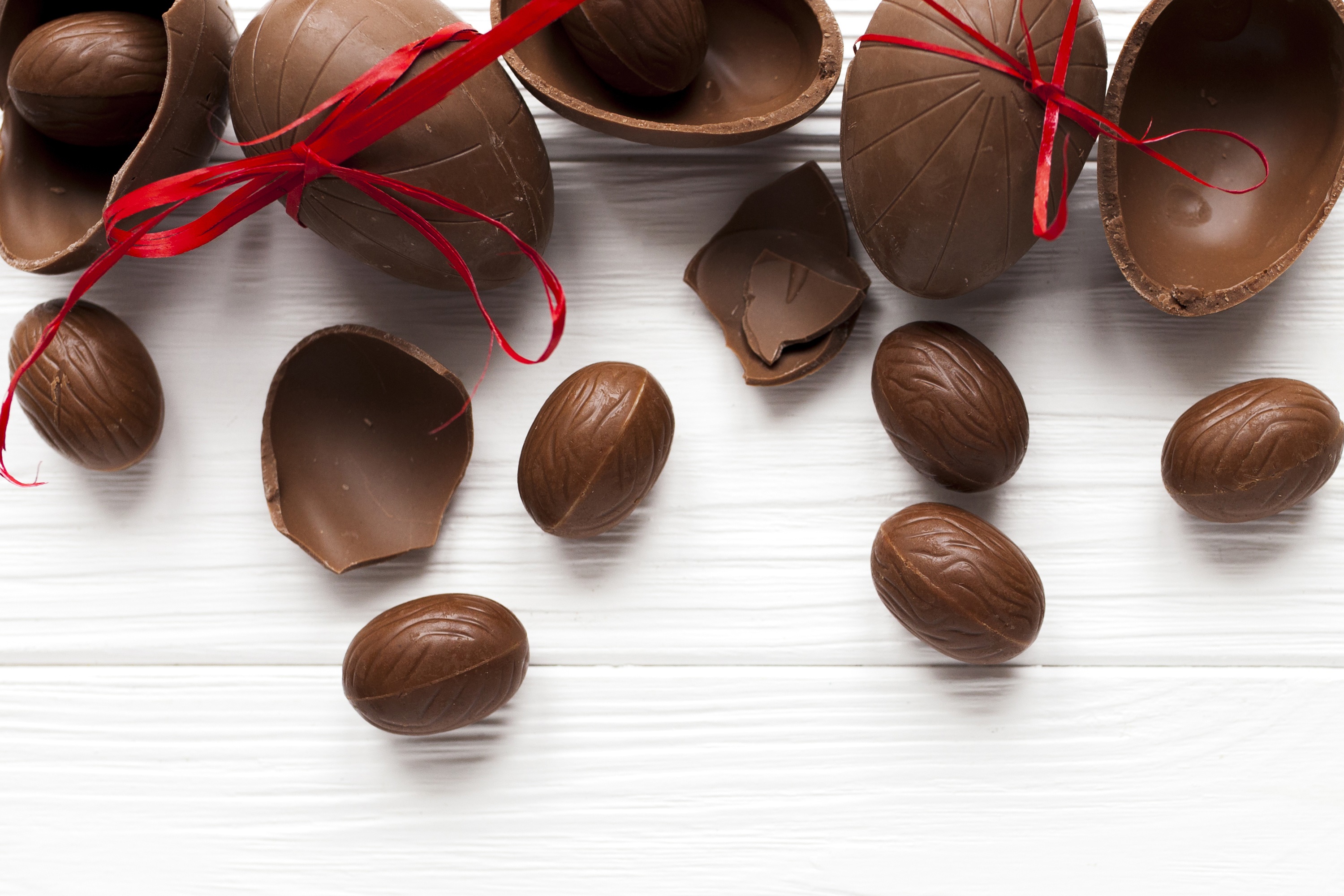 Chocolate Easter Eggs with Red Ribbons HD Wallpaper