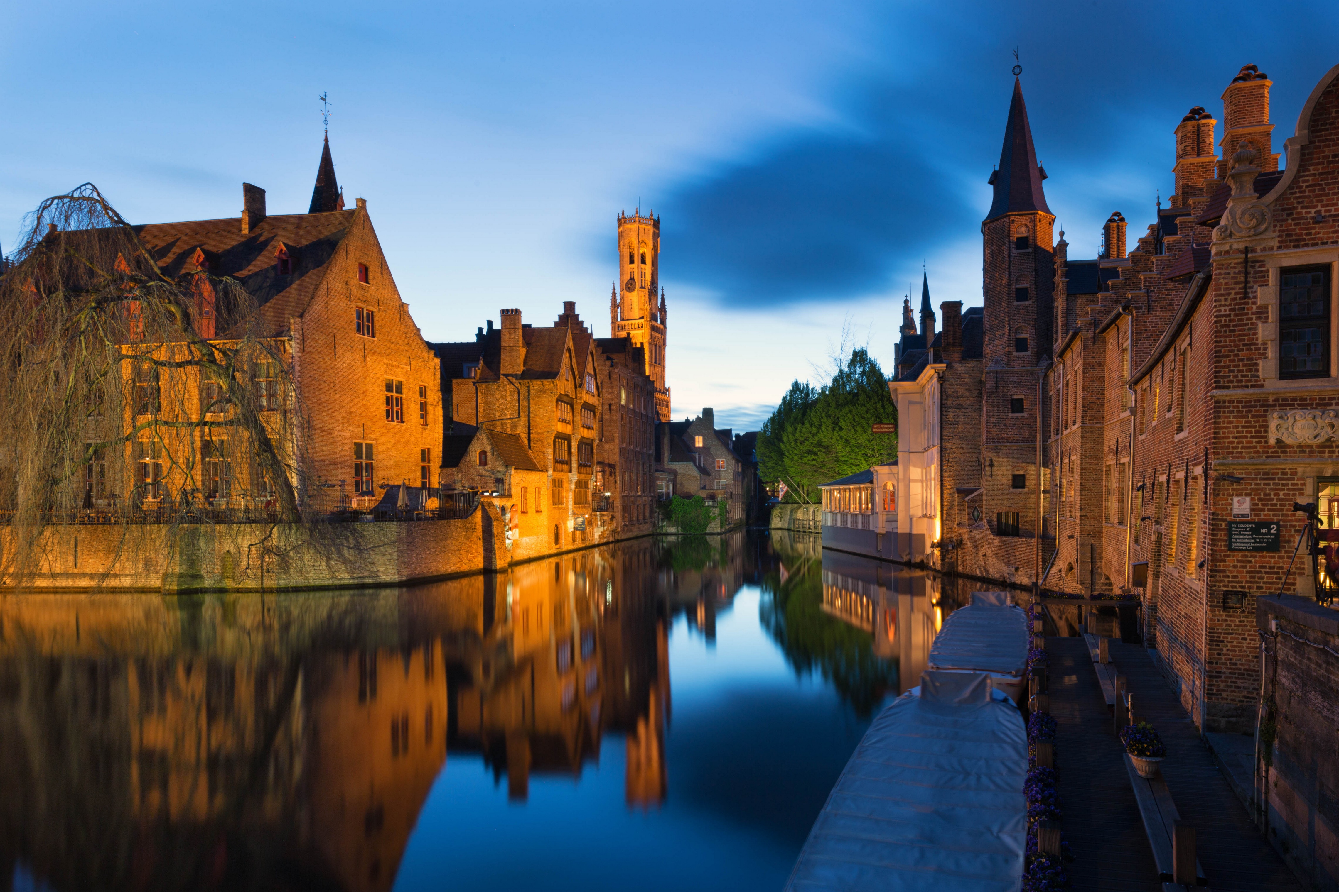 Bruges Canal with historic buildings and Belfry tower HD Wallpaper