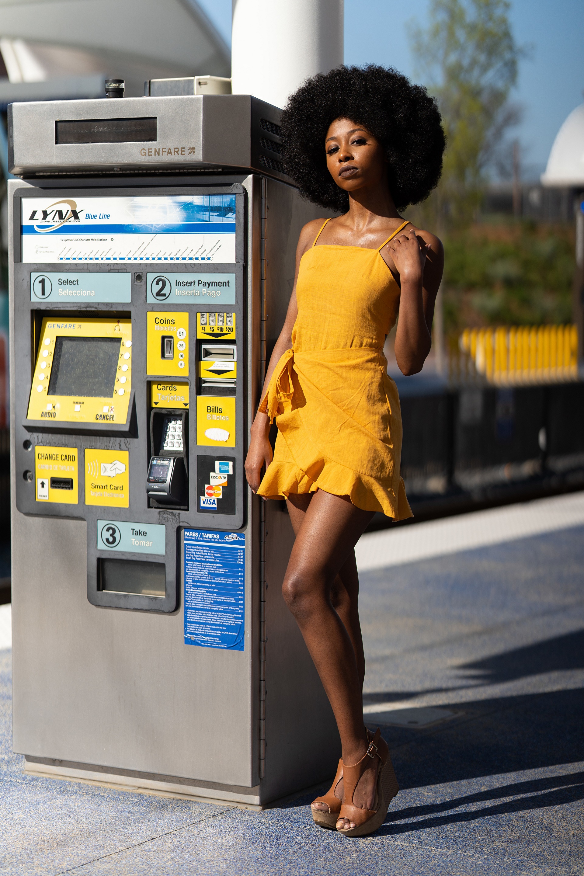 Woman in yellow dress by LYNX Blue Line ticket machine HD Phone Wallpaper