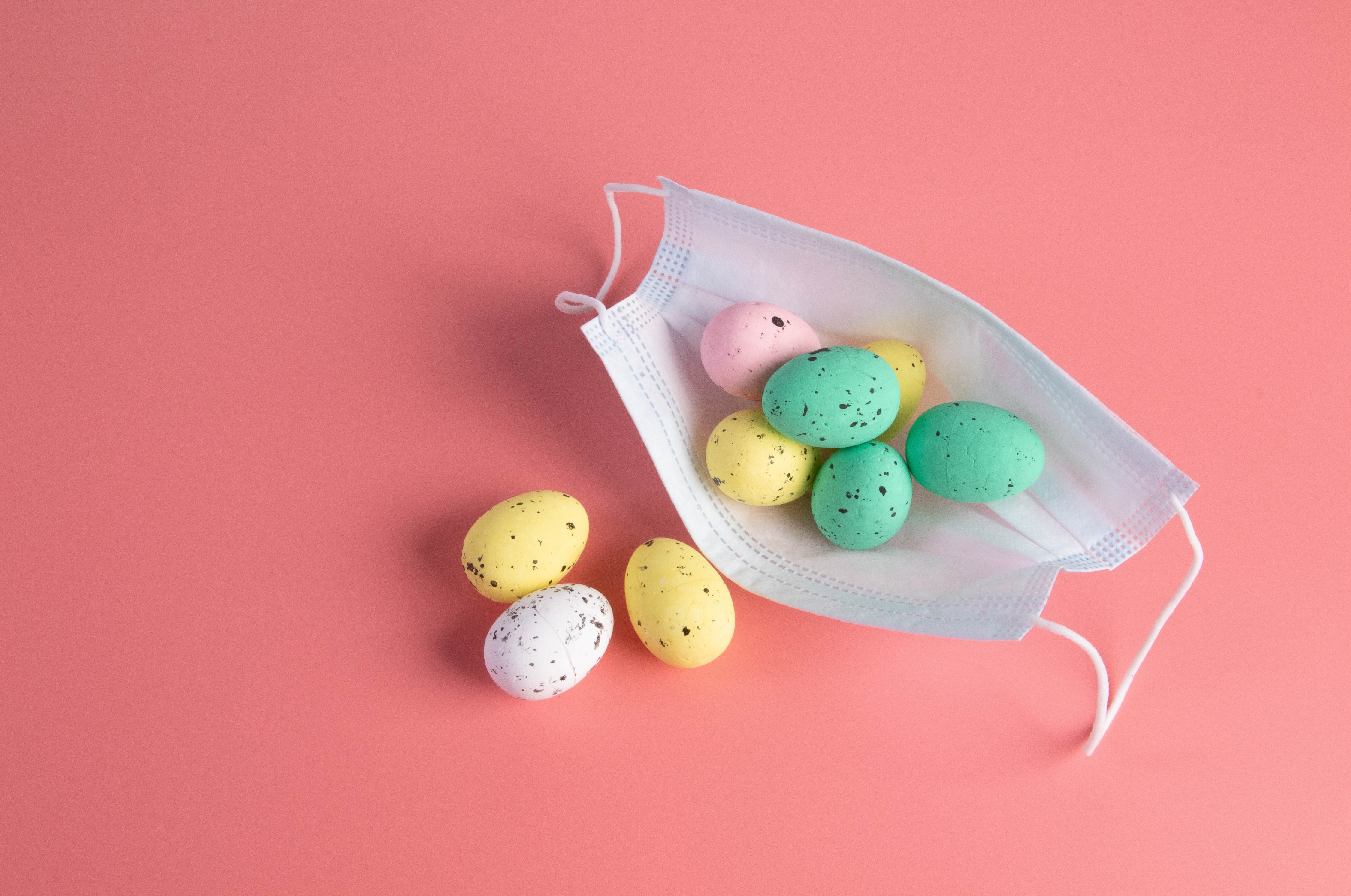 Easter Eggs in a Face Mask on Pink Background HD Wallpaper