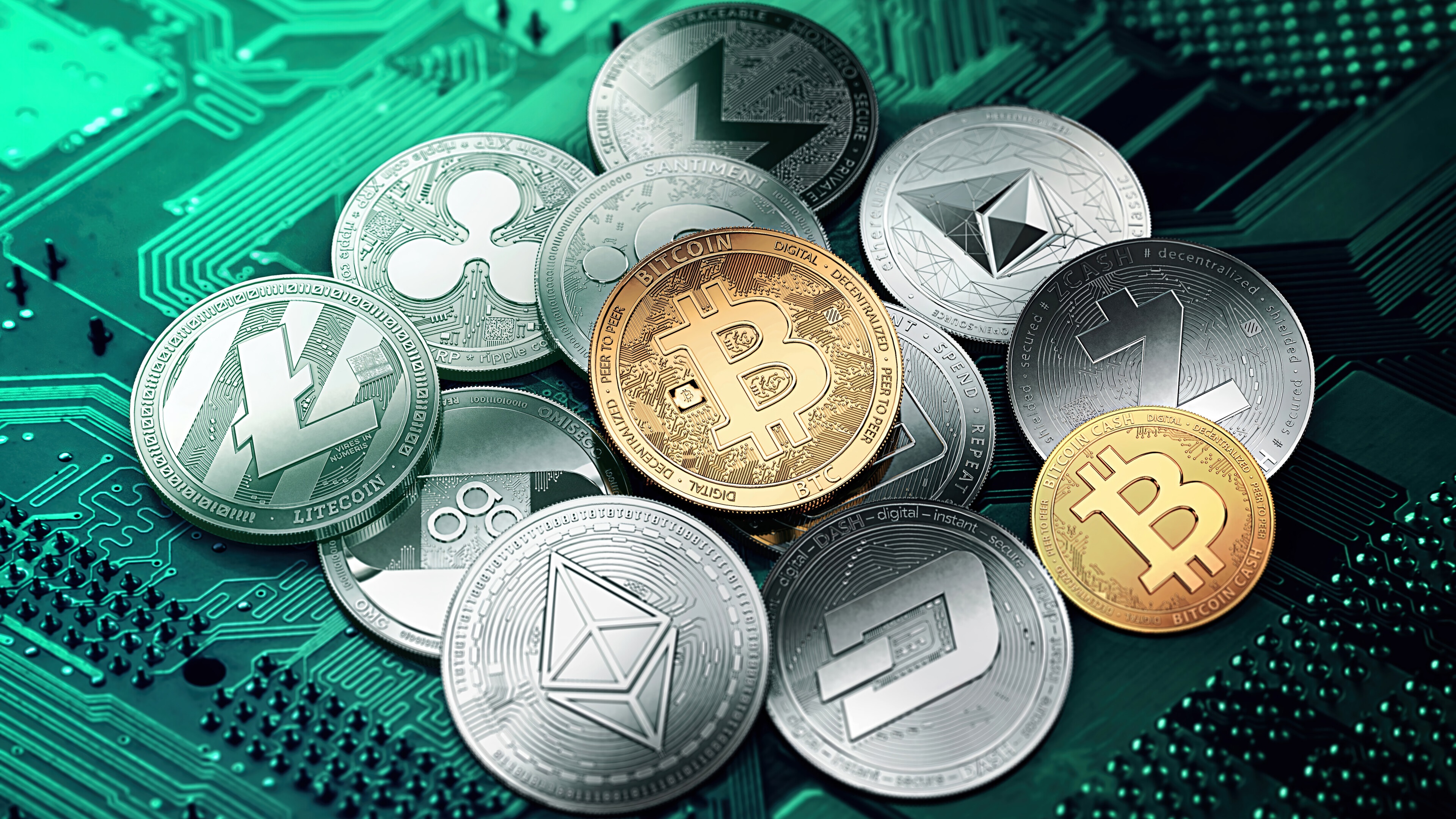 Cryptocurrency coins including Bitcoin, Litecoin, and Ethereum on a circuit board HD Wallpaper