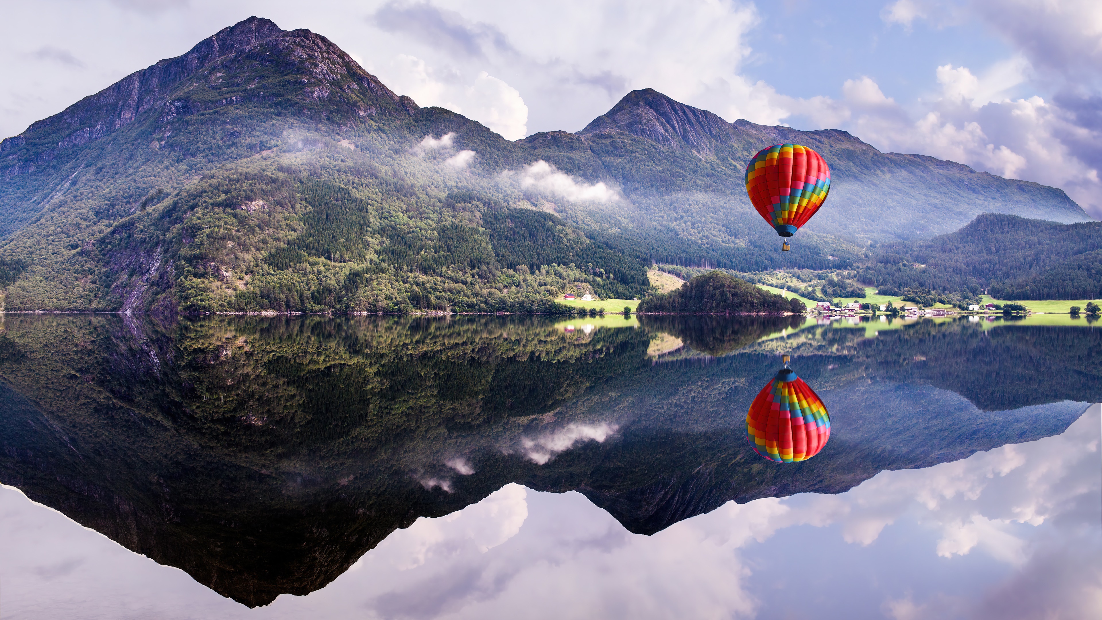 Hot air balloon over a lake with mountains and reflection 4K HD Wallpaper