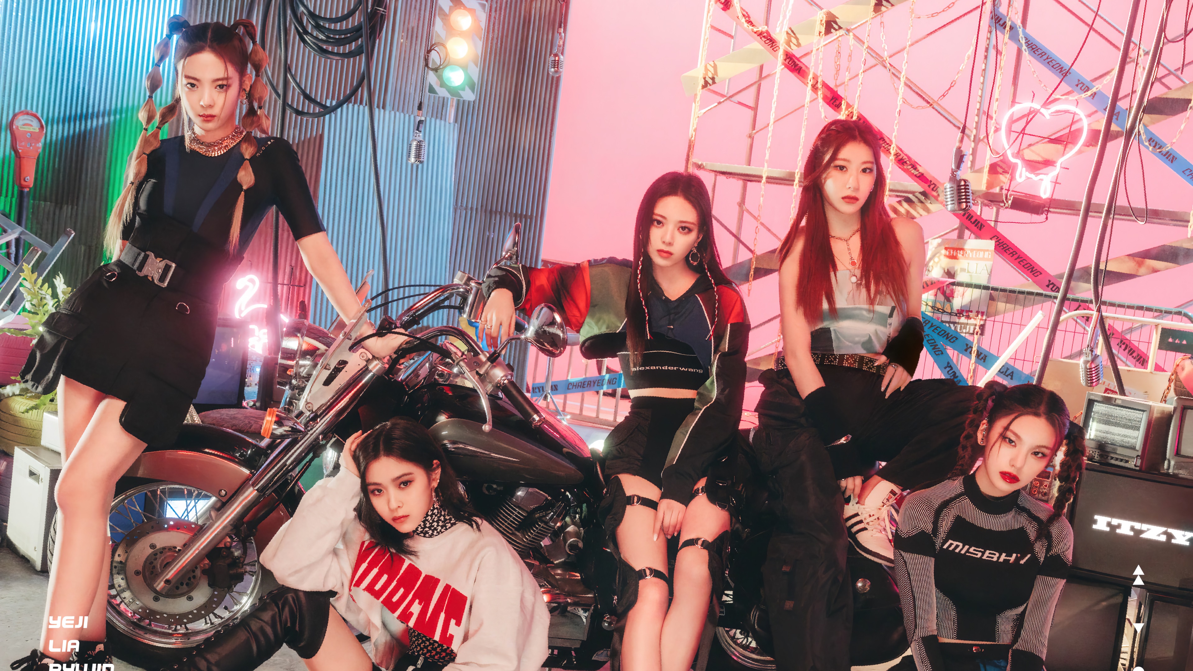 ITZY members posing with a motorcycle HD Wallpaper