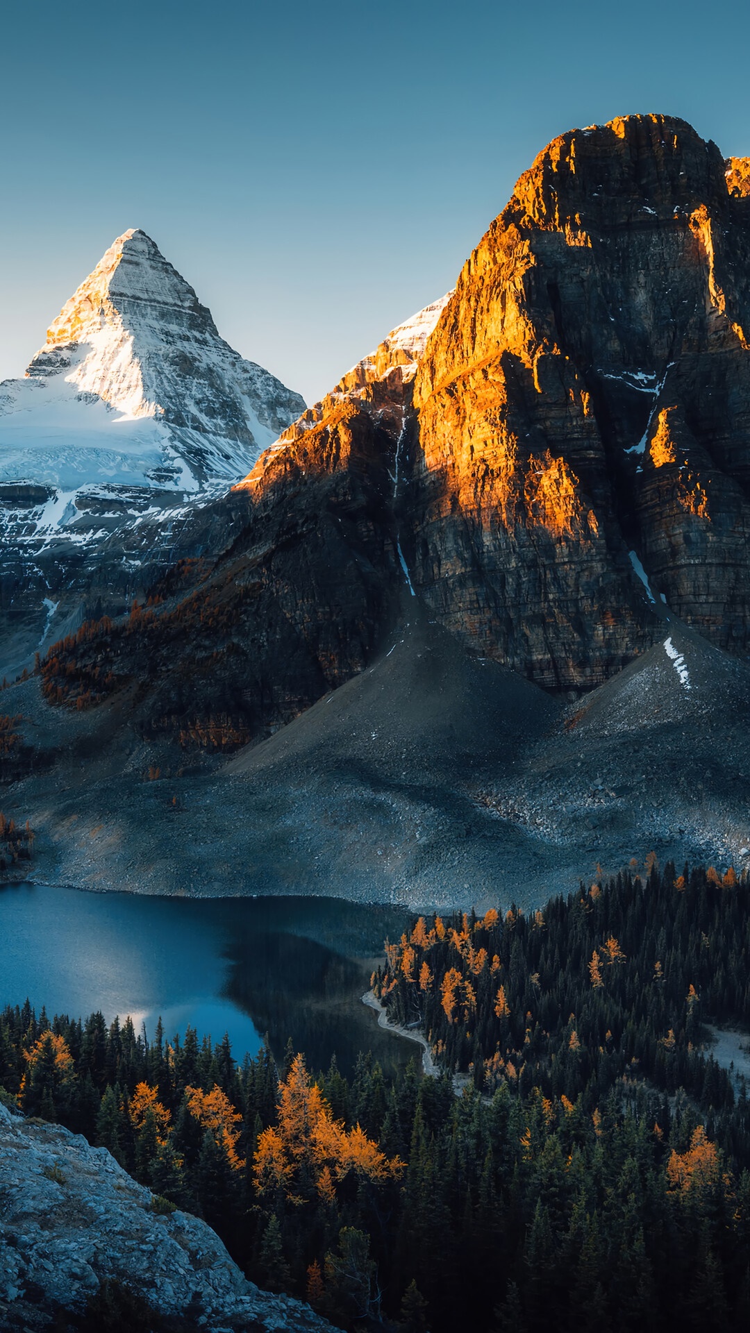Snowy mountain range overlooking a lake and forest HD Phone Wallpaper