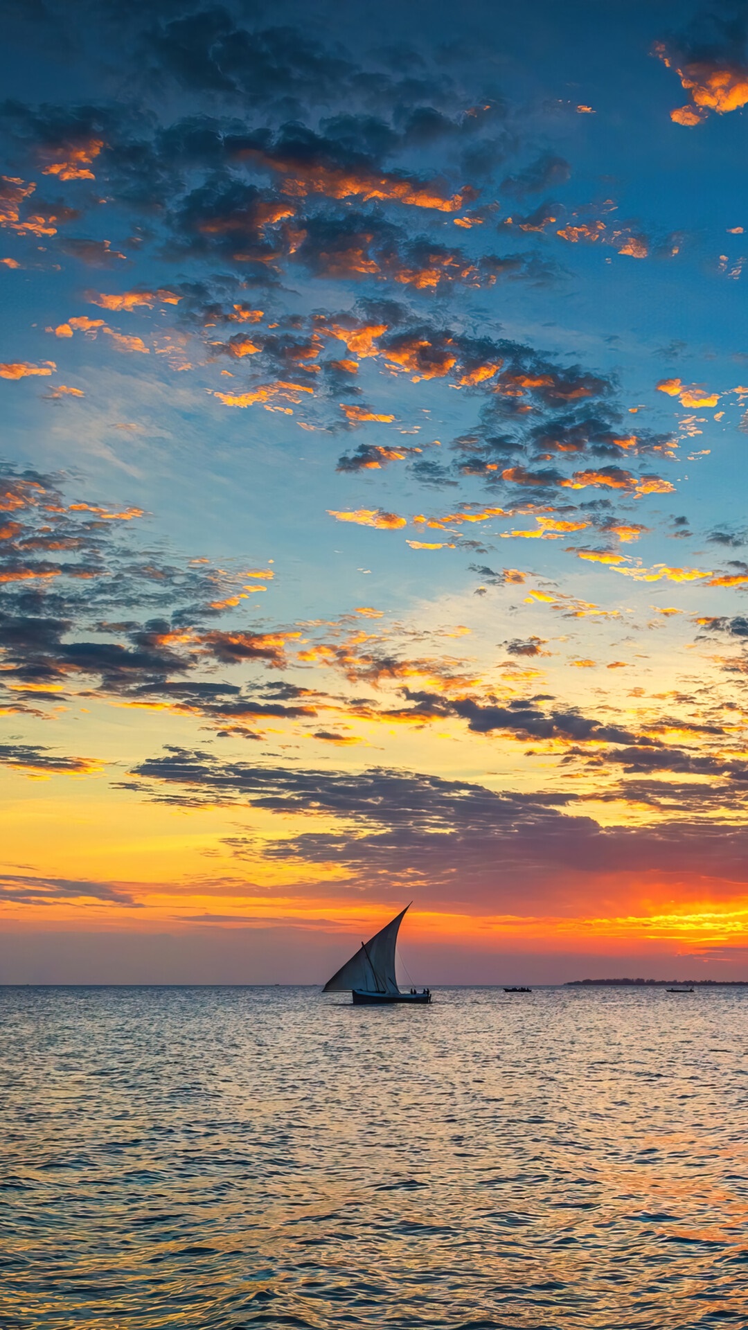 Sailboat on the ocean at sunset with clouds HD Phone Wallpaper