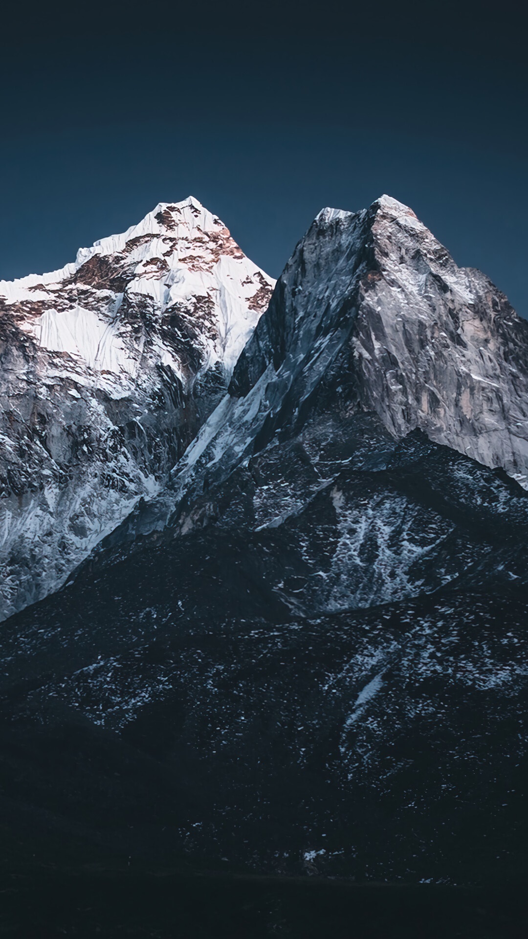 Snowy mountains against a dark blue sky HD Phone Wallpaper