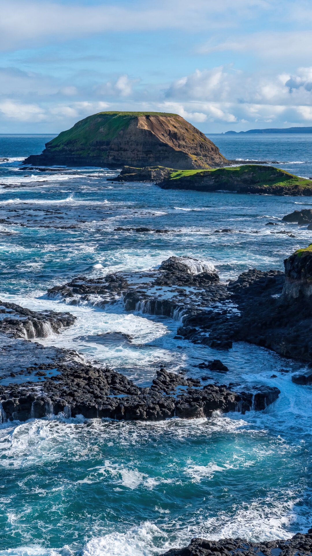 Rocky coastline with island in the sea HD Phone Wallpaper