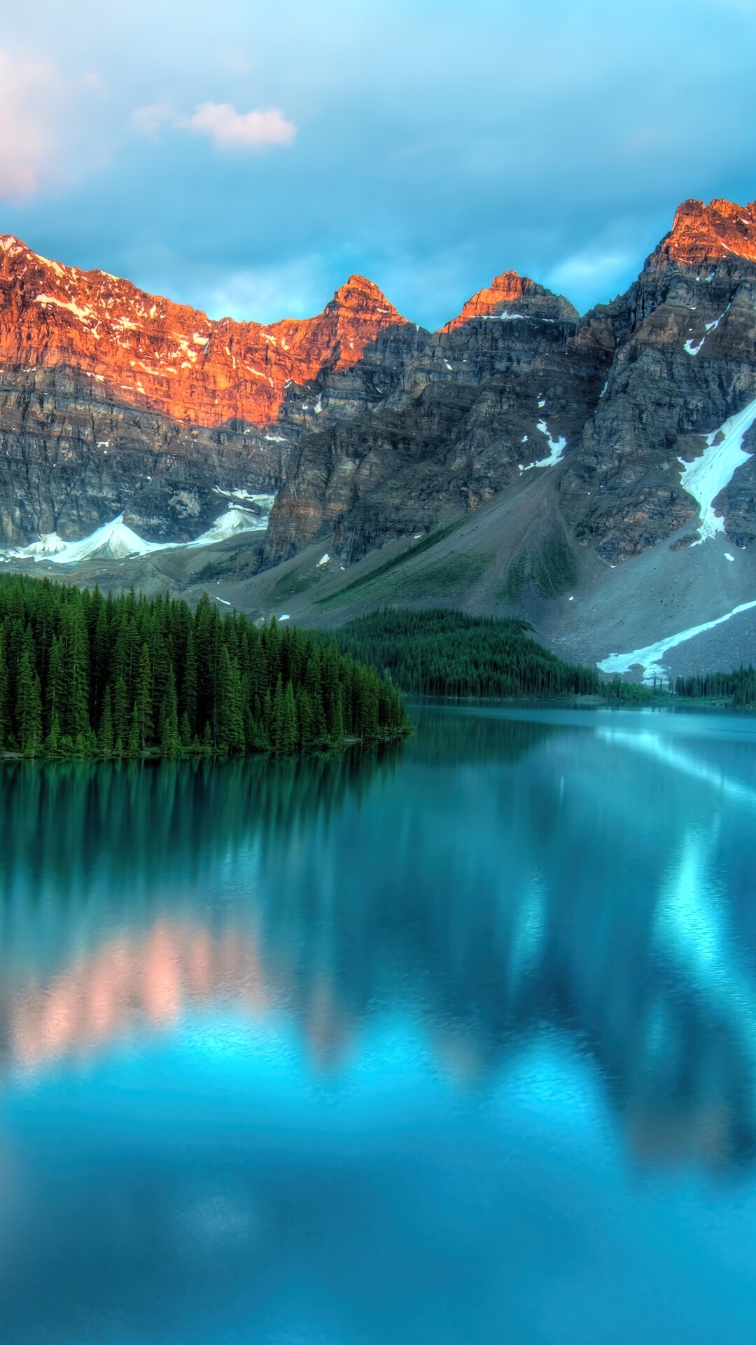 Mountains reflected in a turquoise lake with pine forest HD Phone Wallpaper
