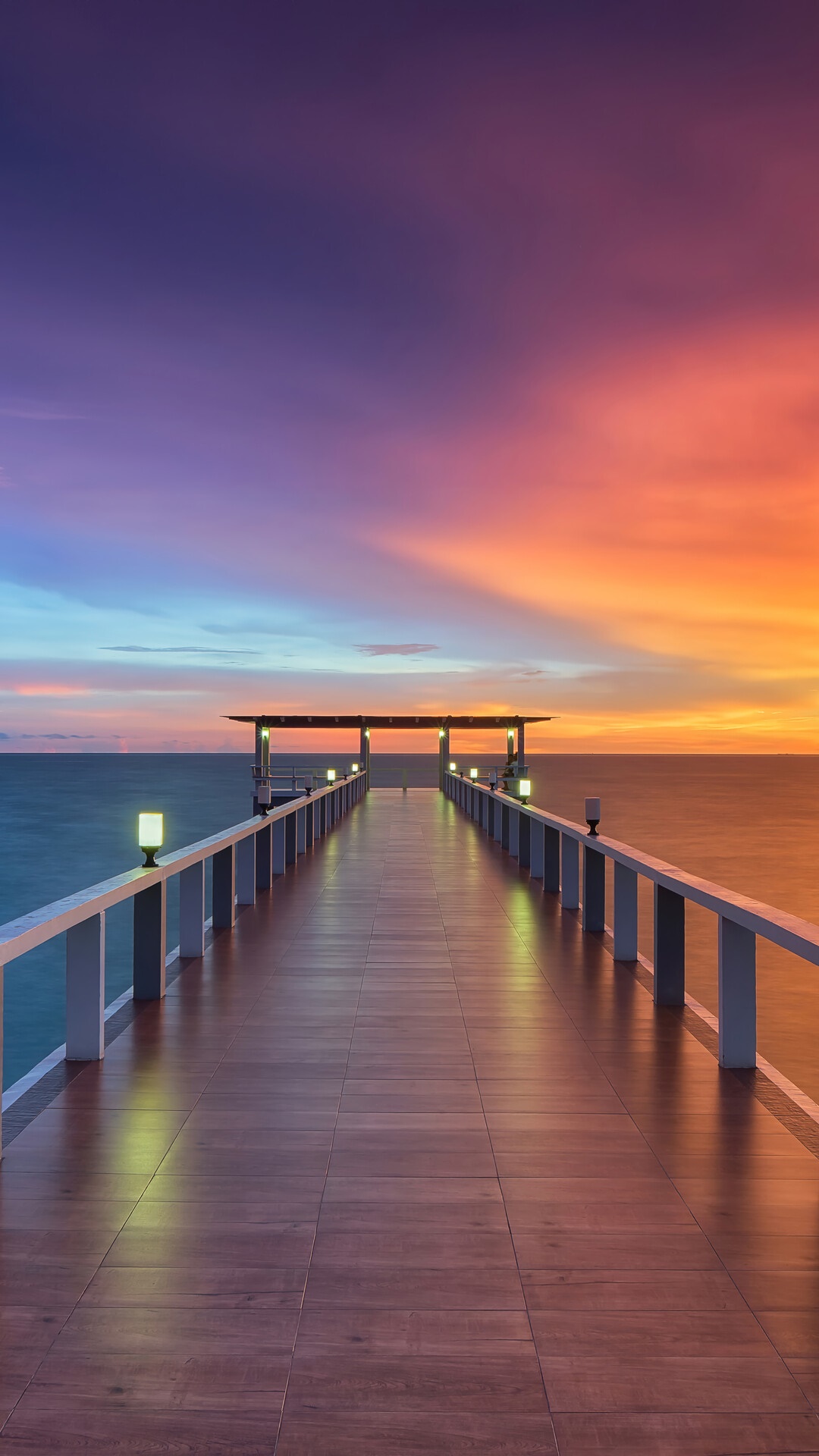 Wooden pier at sunset over the ocean HD Phone Wallpaper