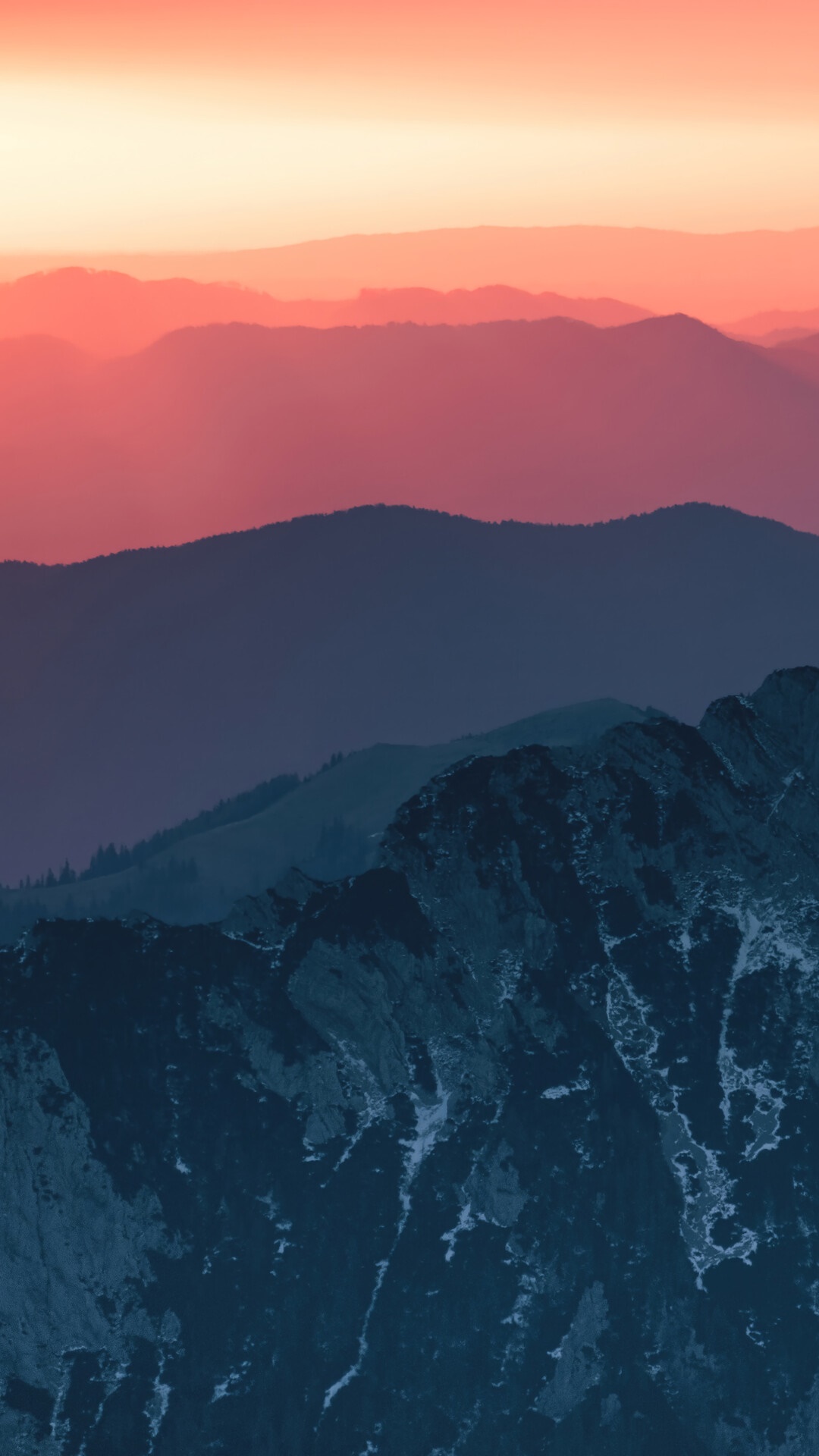 Layered mountains at sunset with pink and blue hues HD Phone Wallpaper