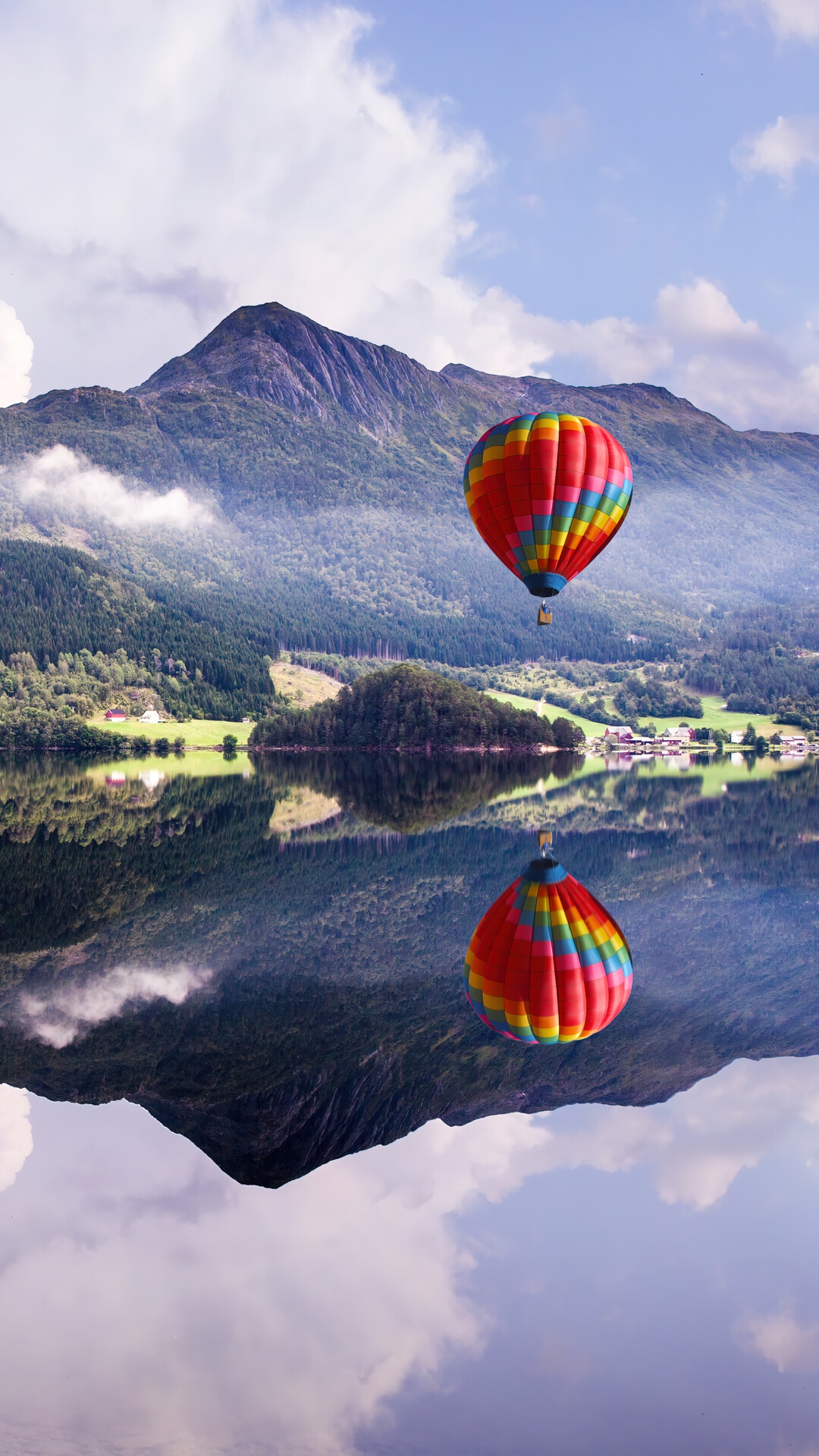 Hot air balloon over a lake with mountains HD Phone Wallpaper