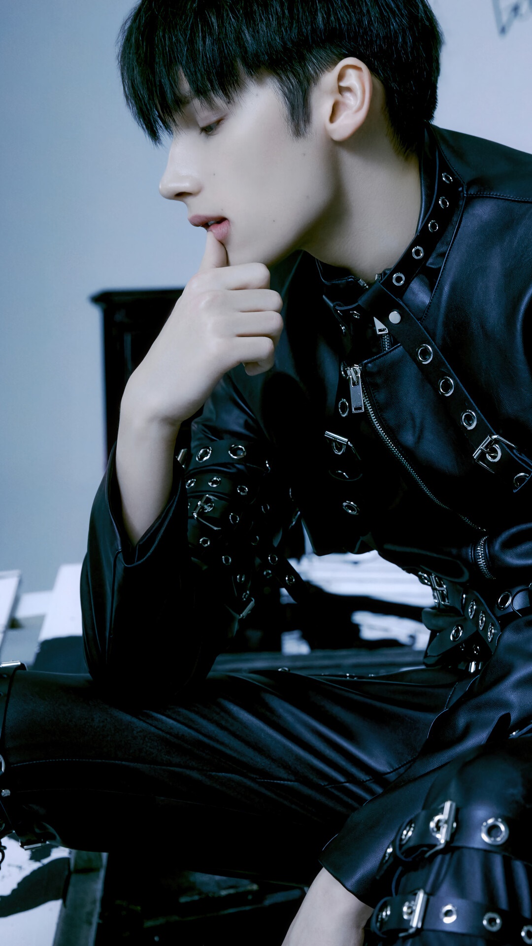 Huening Kai from TXT in black leather outfit HD Phone Wallpaper