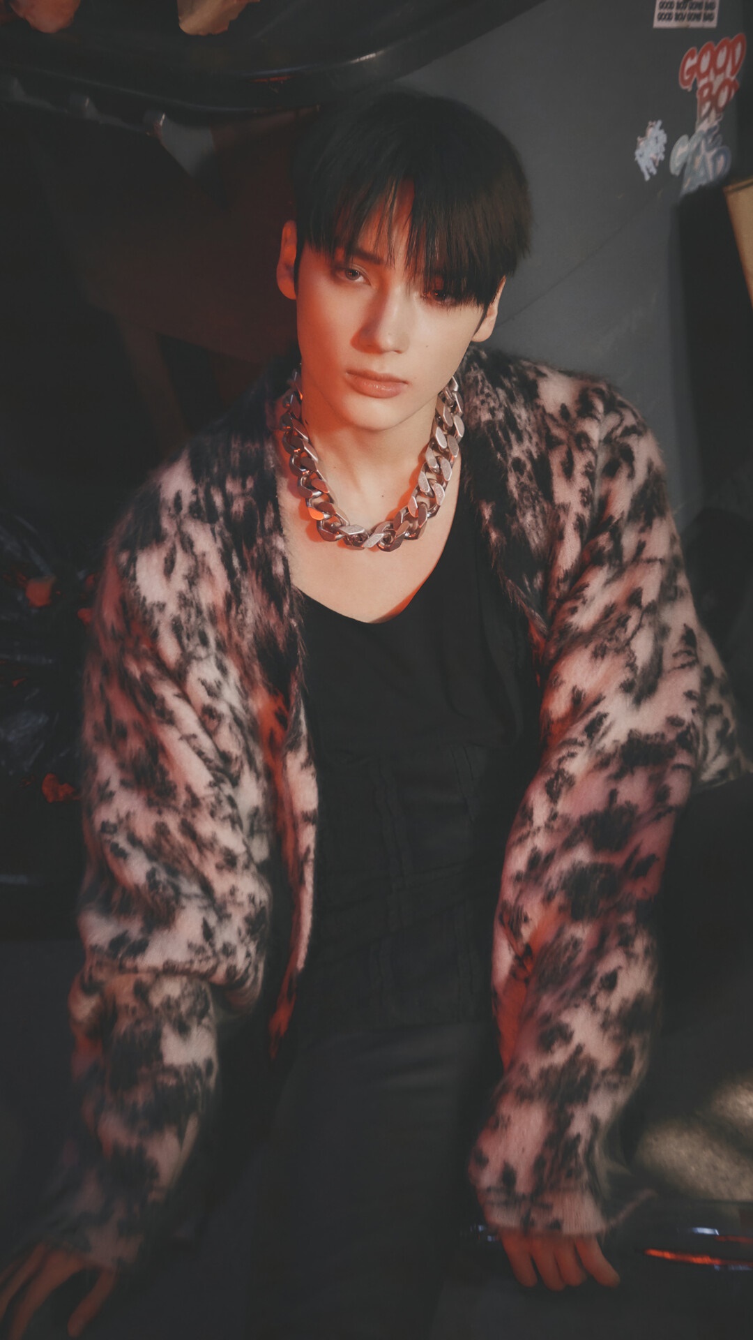 Huening Kai from TXT wearing a leopard print cardigan HD Phone Wallpaper