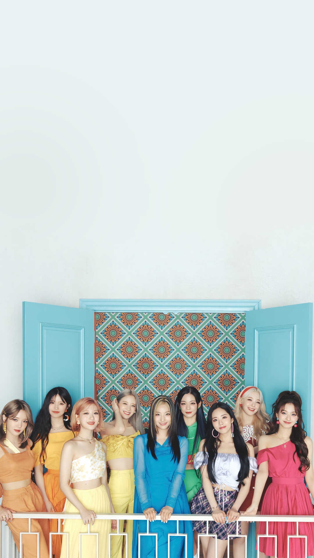 Fromis 9 Kpop group posing in colorful outfits HD Phone Wallpaper