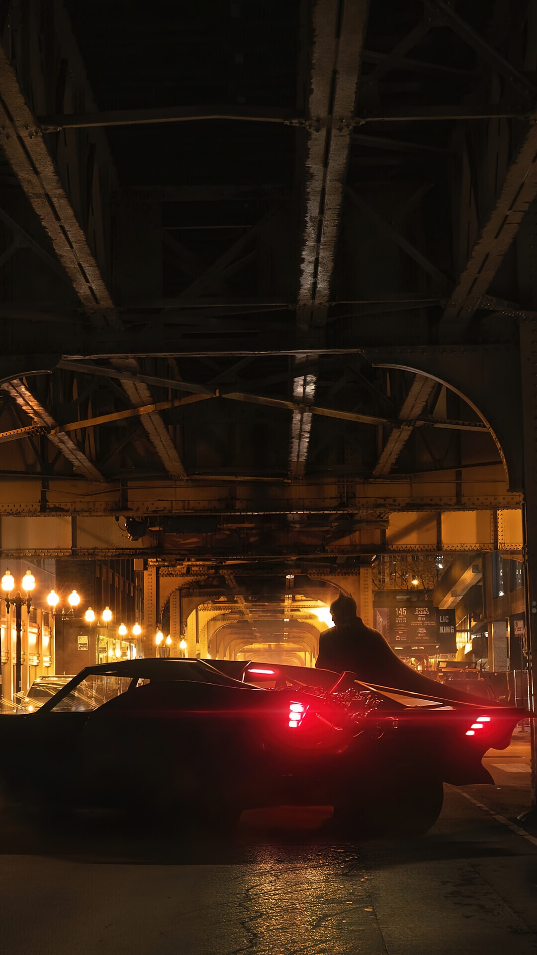 Batman and Batmobile under a bridge at night HD Phone Wallpaper