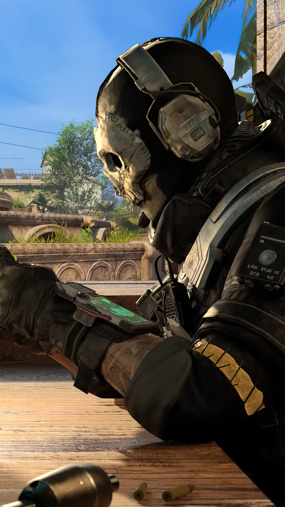 Ghost from Call of Duty Mobile holding a device HD Phone Wallpaper