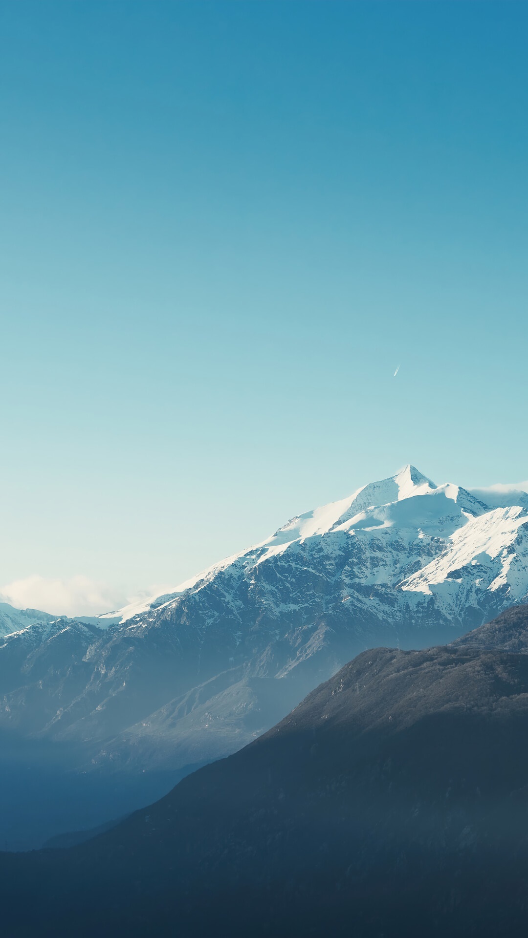 Snow-capped mountains under a clear blue sky HD Phone Wallpaper