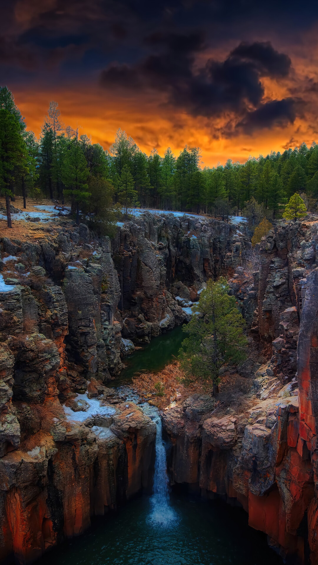 Waterfall in a forest canyon at sunset HD Phone Wallpaper