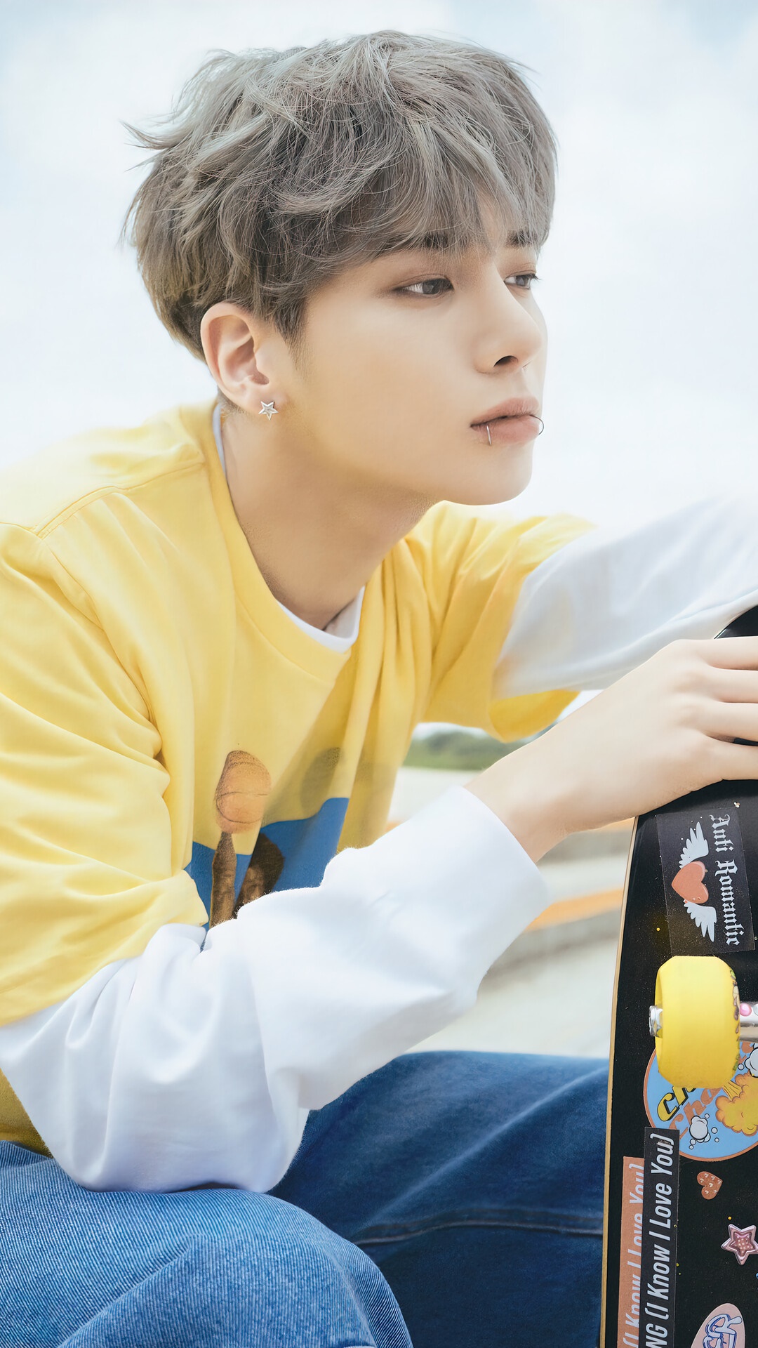 Taehyun from TXT with a skateboard HD Phone Wallpaper