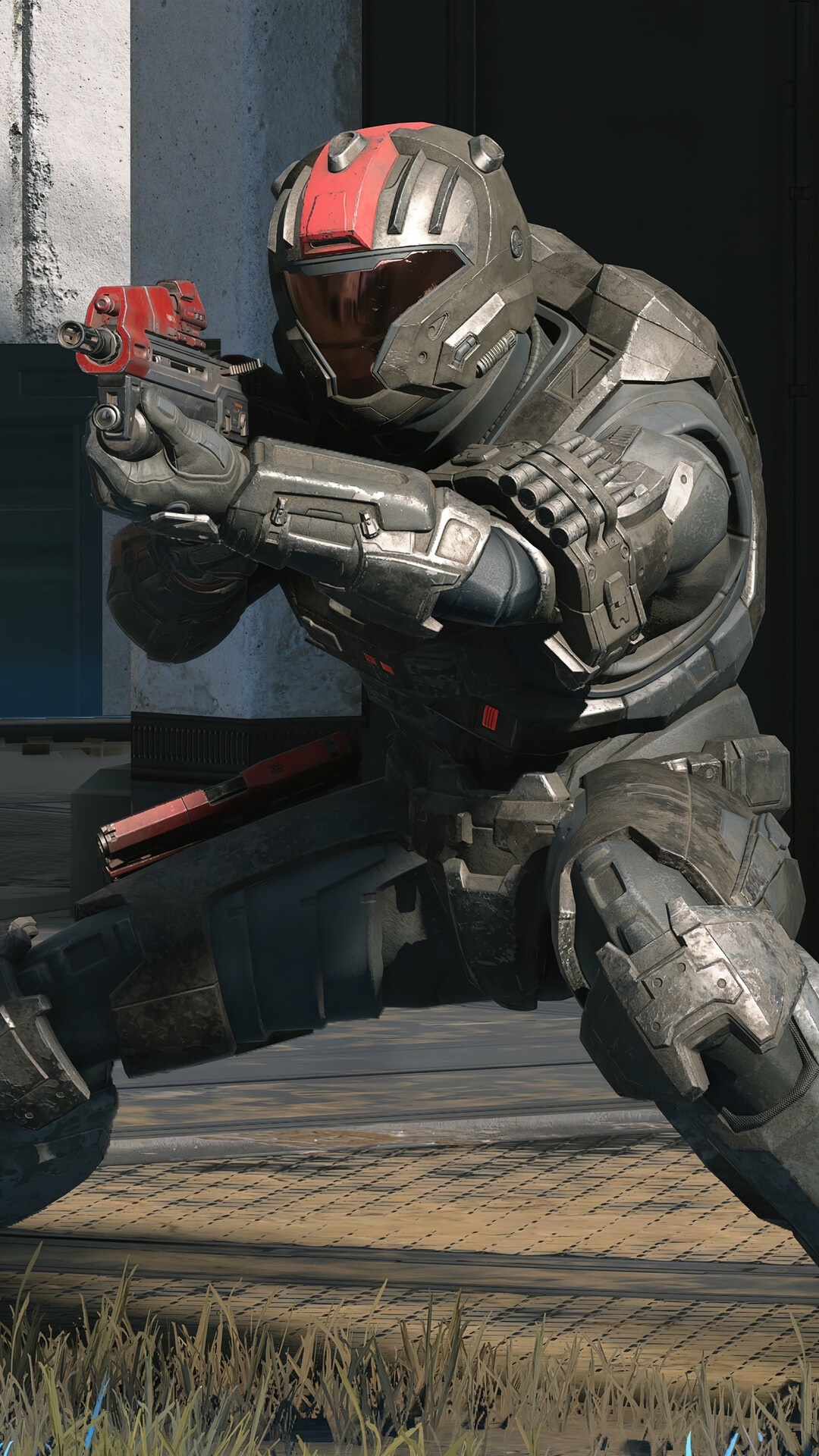 Spartan soldier from Halo Infinite holding a weapon HD Phone Wallpaper