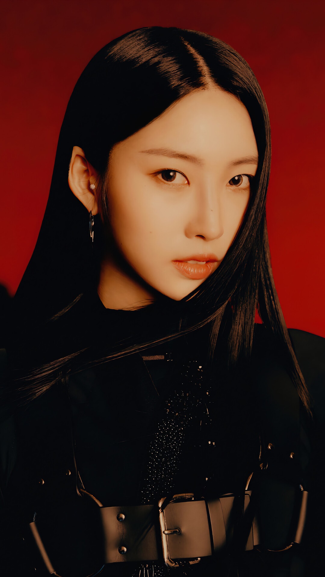Sihyeon from EVERGLOW posing against a red background HD Phone Wallpaper