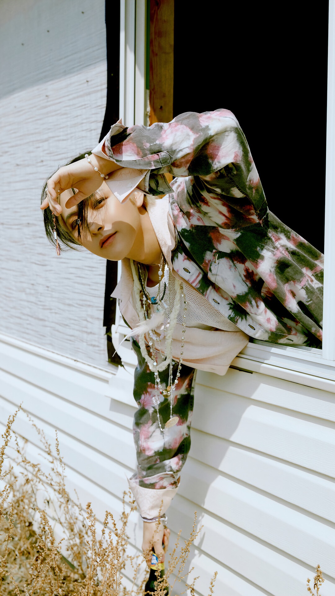 Renjun from NCT Dream leaning out of a window HD Phone Wallpaper