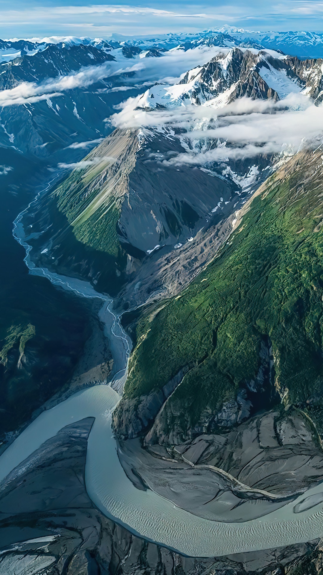 Aerial view of a glacial river flowing through mountains HD Phone Wallpaper