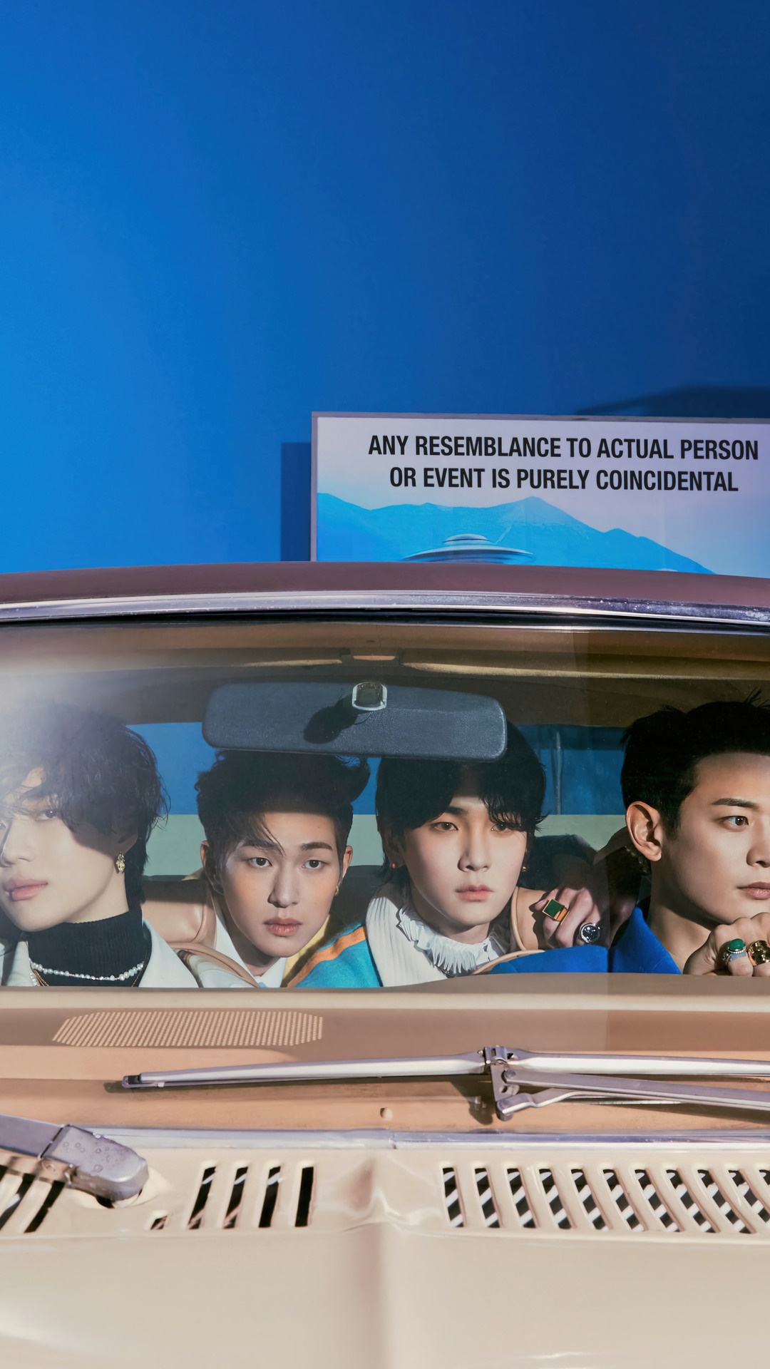 Shinee members in a car with a sign in the background HD Phone Wallpaper