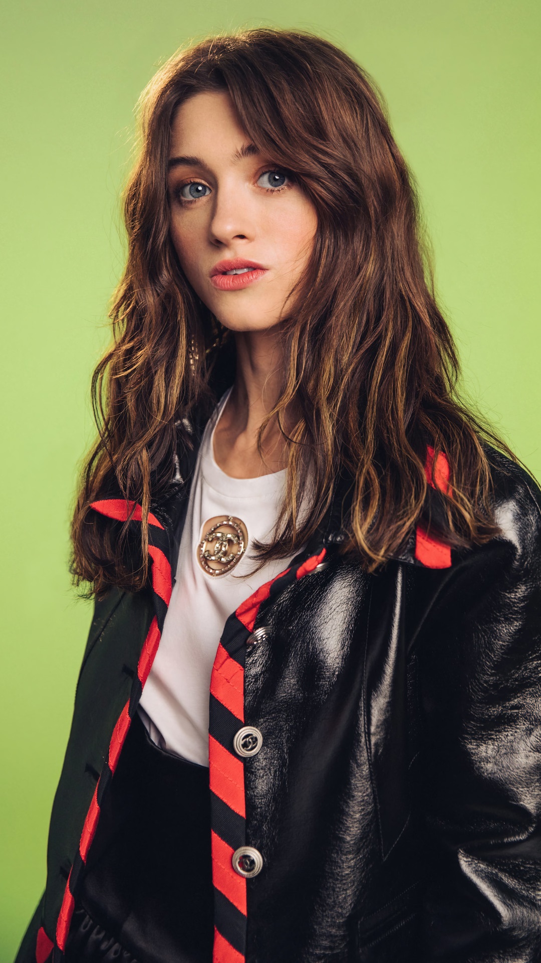 Natalia Dyer wearing a black jacket with red trim HD Phone Wallpaper