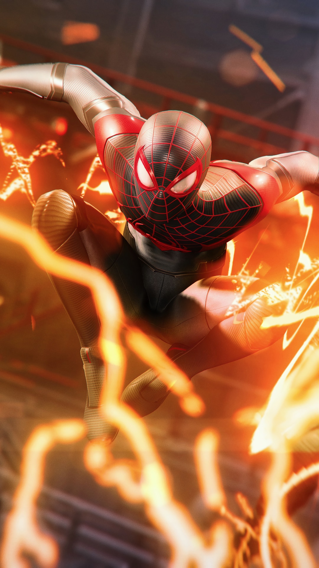 Spider-Man Miles Morales in action with orange energy HD Phone Wallpaper