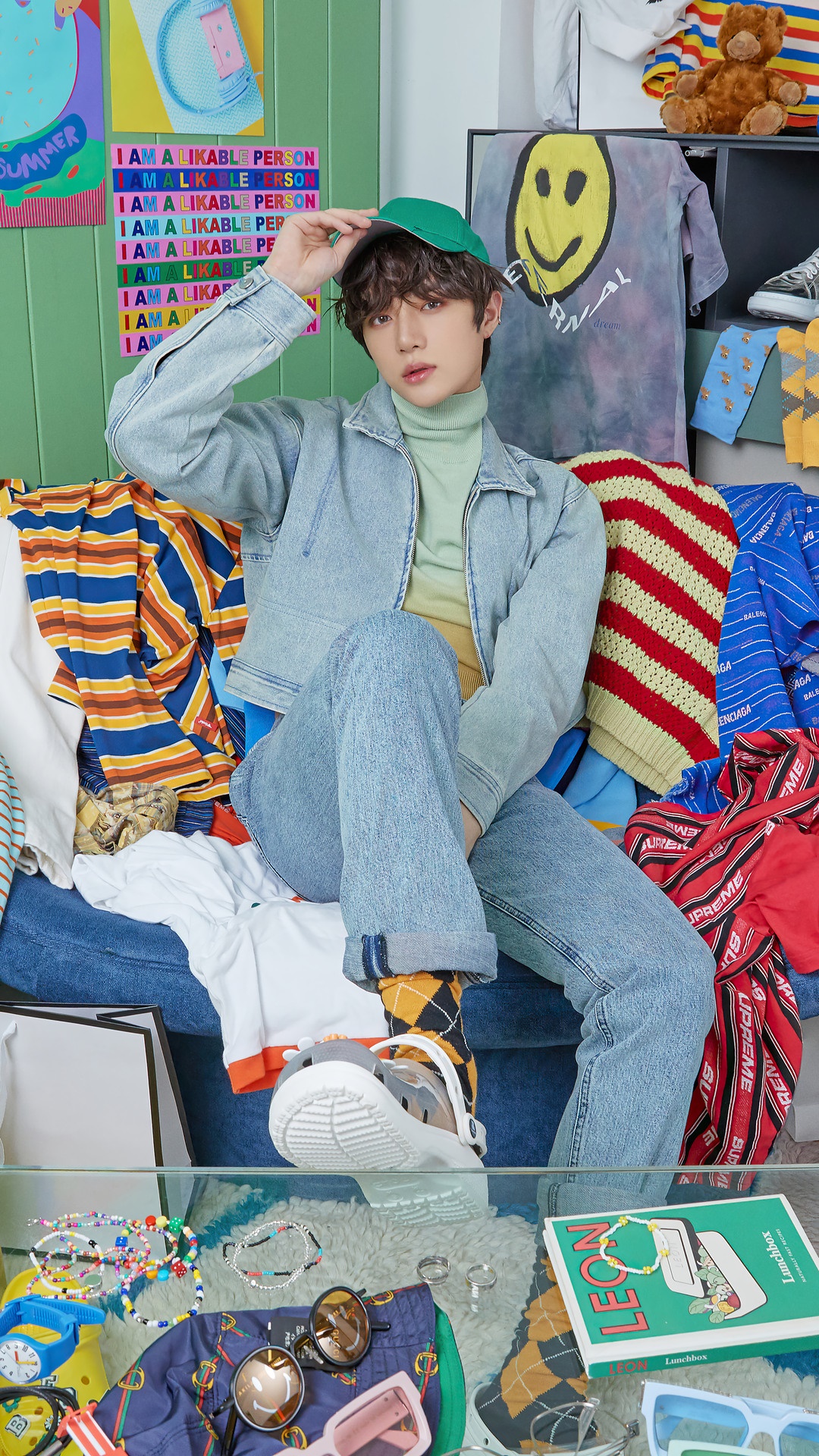 Beomgyu from TXT wearing denim and a green cap HD Phone Wallpaper