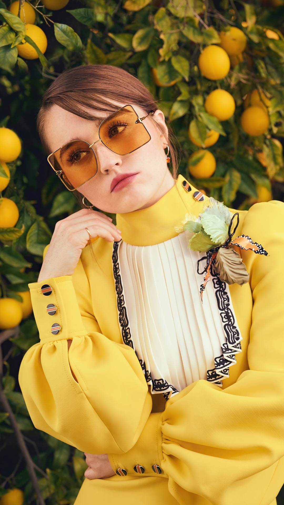 Kaitlyn Dever wearing sunglasses and a yellow dress HD Phone Wallpaper