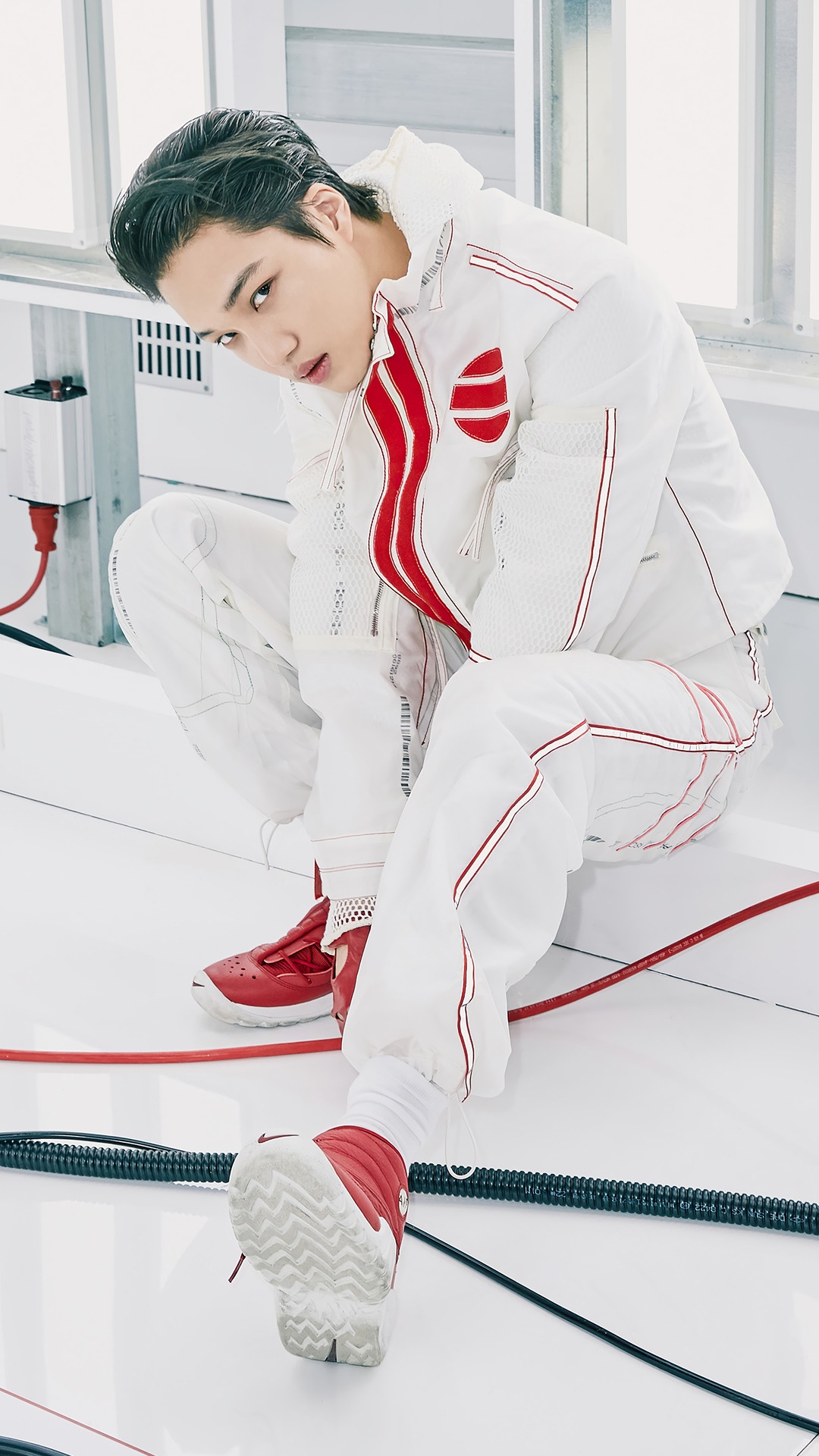 Kai from SuperM in white and red athletic wear HD Phone Wallpaper