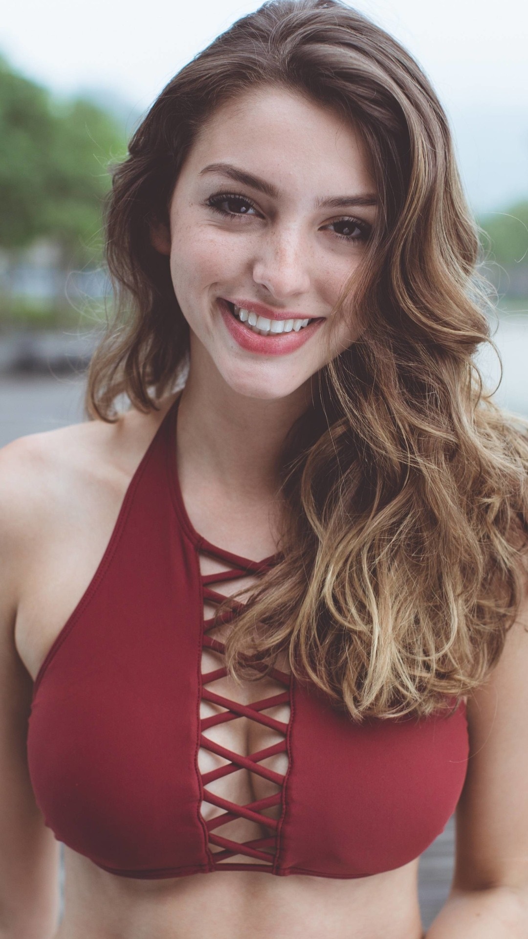 Celine Farach smiling in a red bikini HD Phone Wallpaper