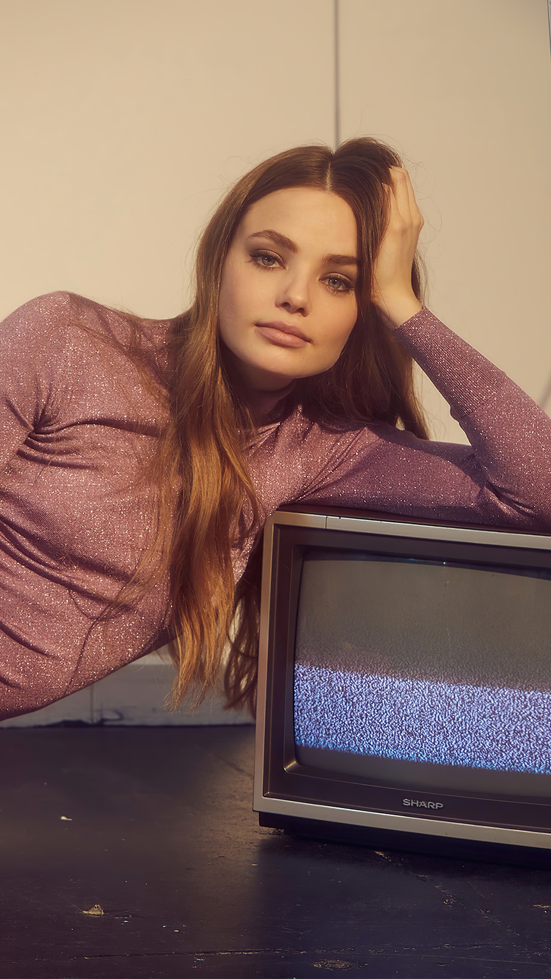 Kristine Froseth posing with a vintage television HD Phone Wallpaper