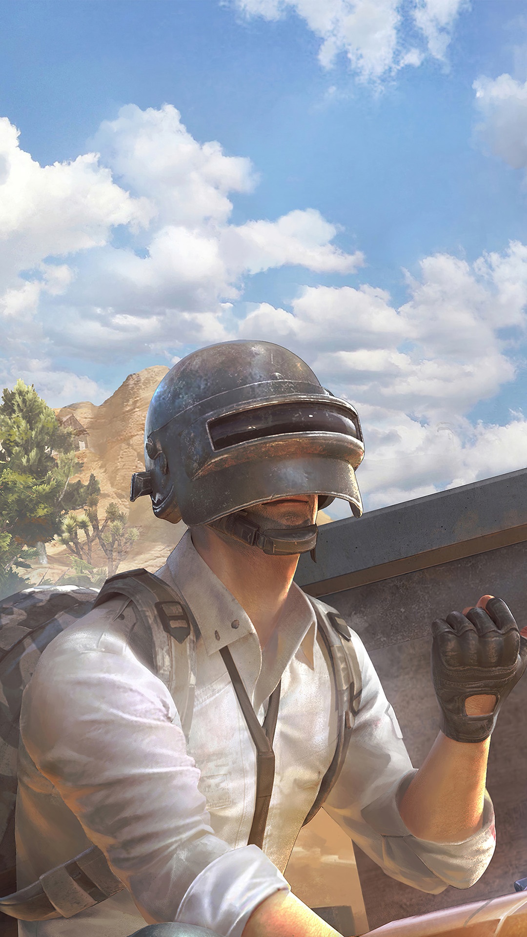 Player in PUBG helmet in a desert landscape HD Phone Wallpaper