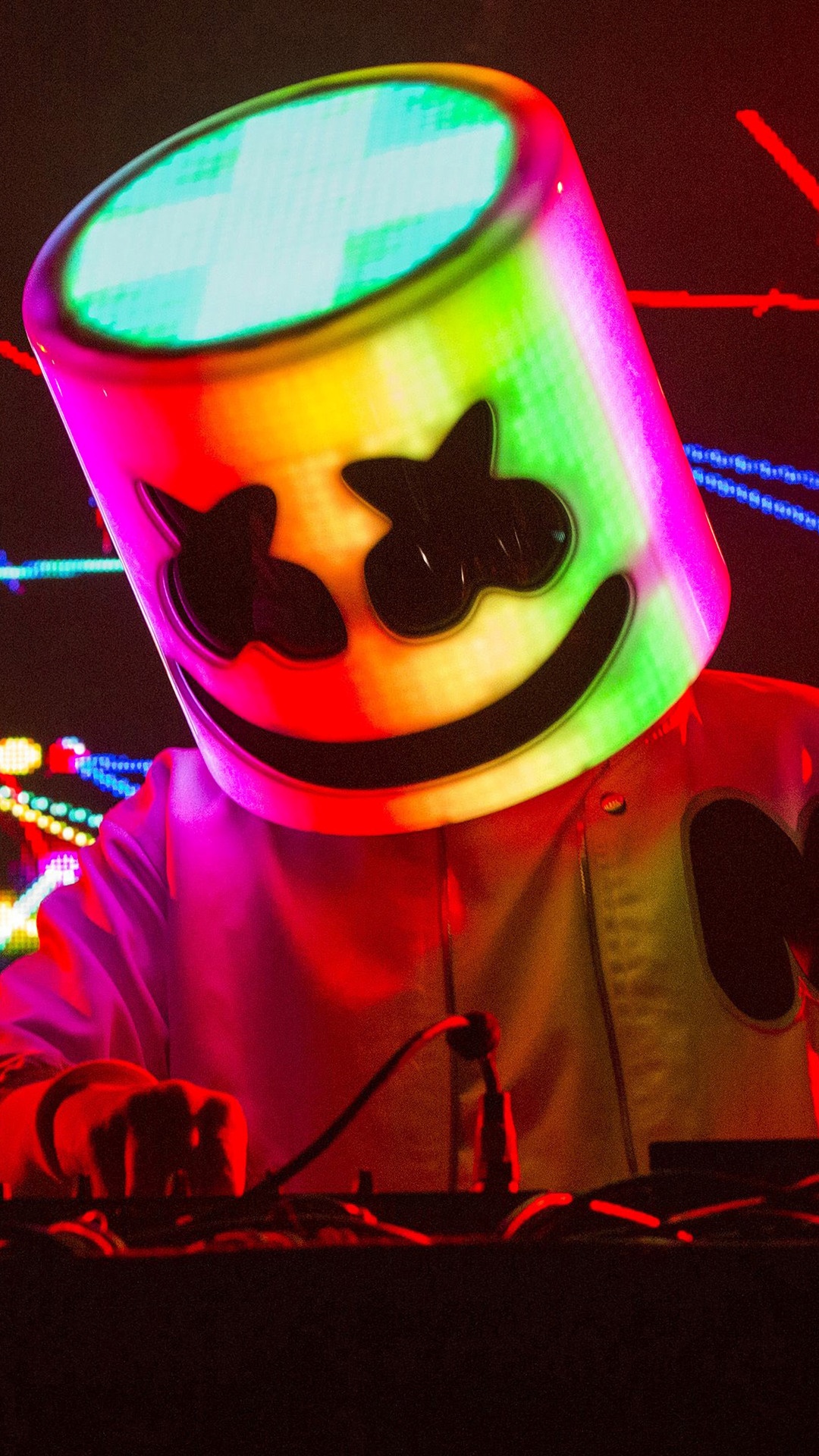 DJ Marshmello performing on stage with colorful lights HD Phone Wallpaper