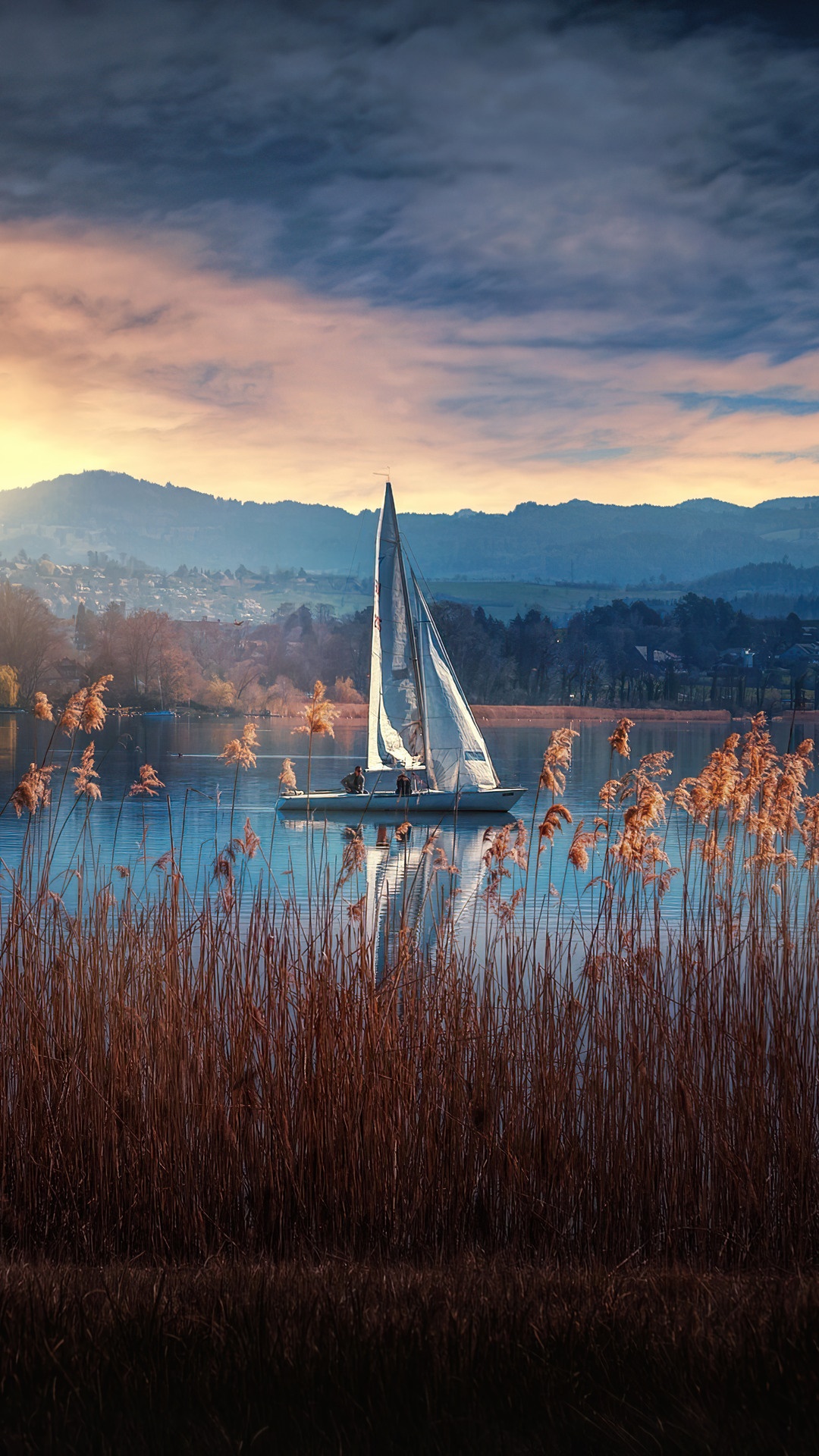 Sailboat on a lake at sunrise with mountains HD Phone Wallpaper