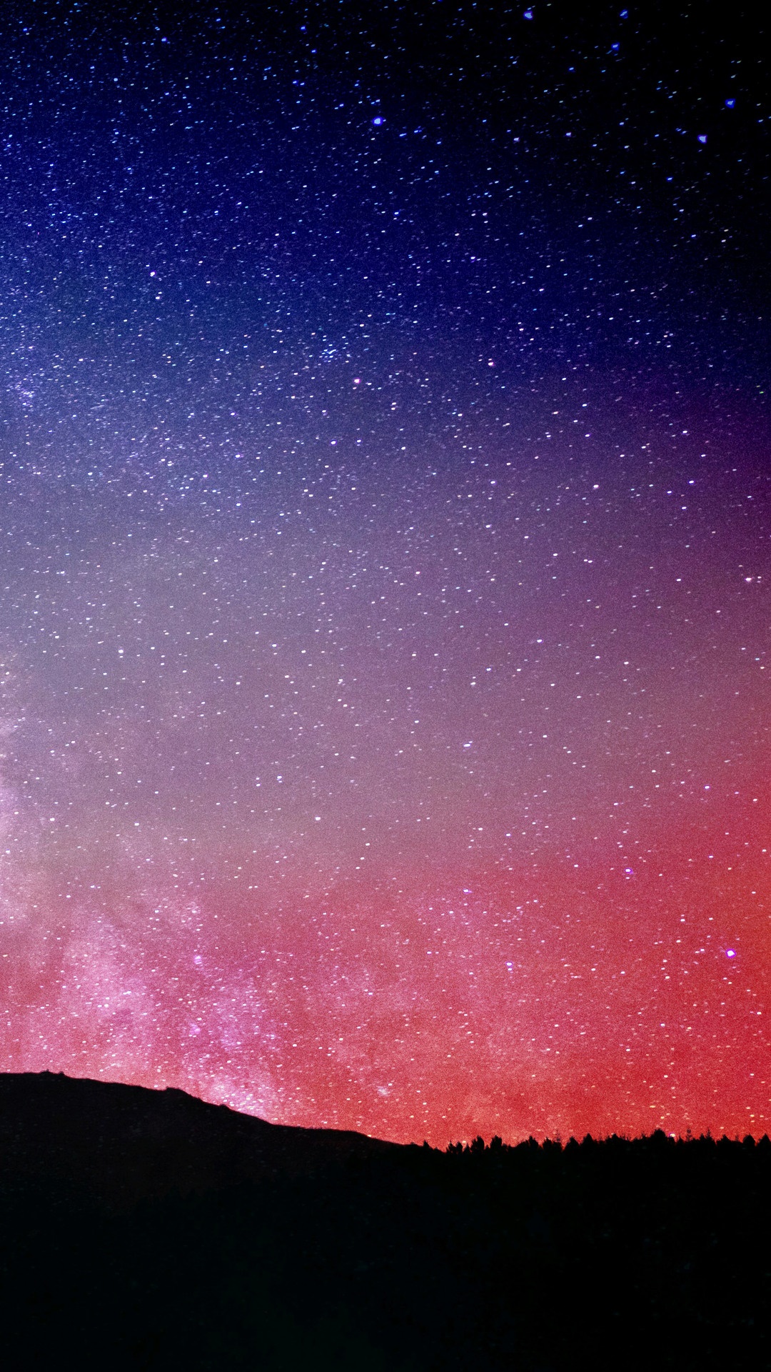 Starry night sky over a silhouetted mountain range HD Phone Wallpaper
