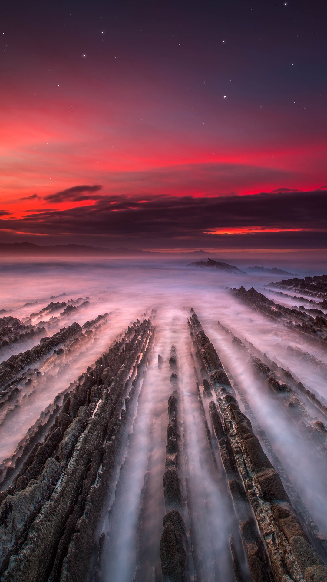 Rocky coastline at sunset with stars HD Phone Wallpaper